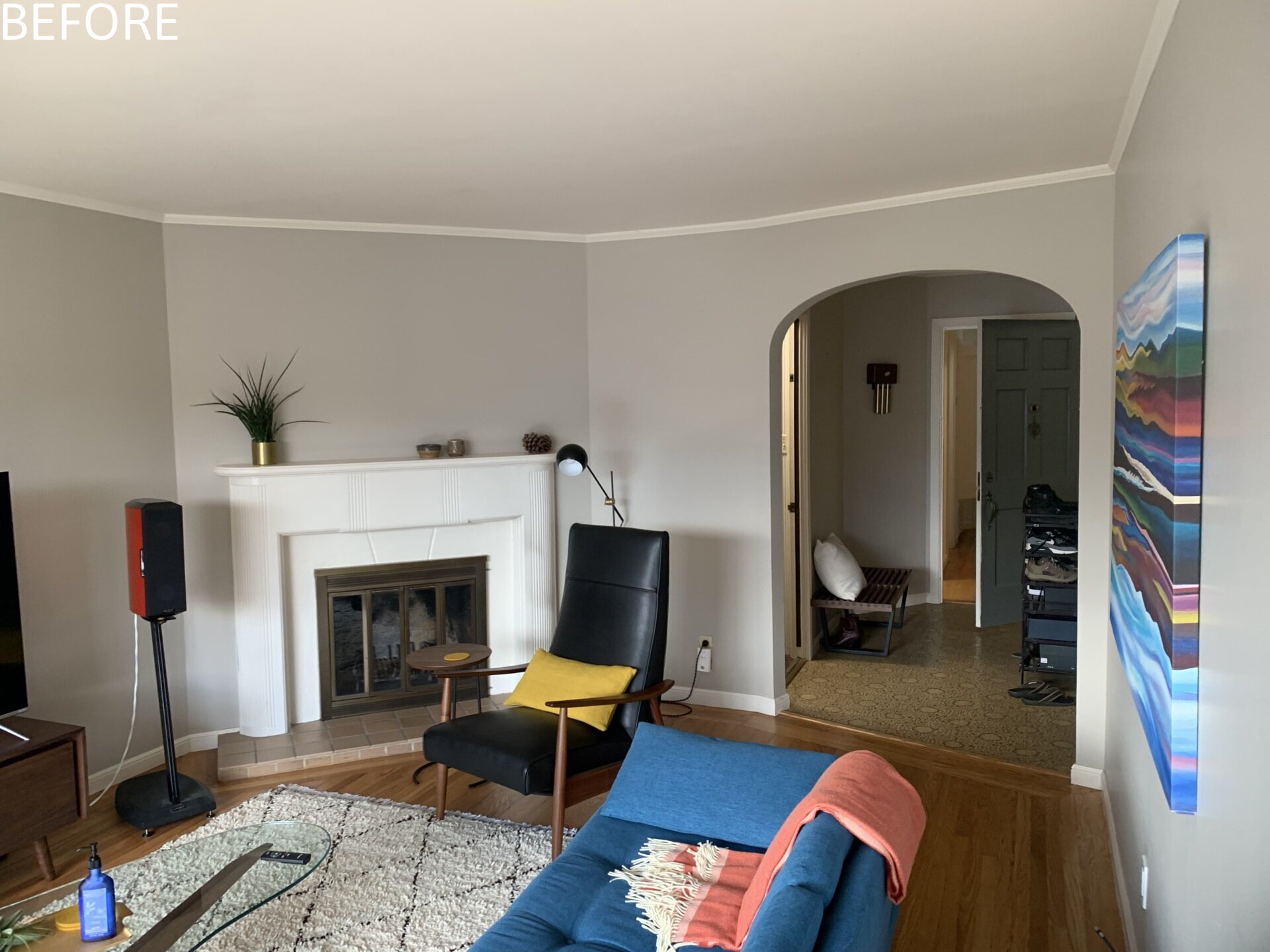 Previously, living spaces were segmented, cutting off visual connections and natural light. The layout felt constrained by its compartmentalized plan. Now, the living and dining areas unfold within the open upper level. Refinished original oak floors in a deeper tone ground the space, complemented by walnut millwork that adds warmth without overwhelming the volume.