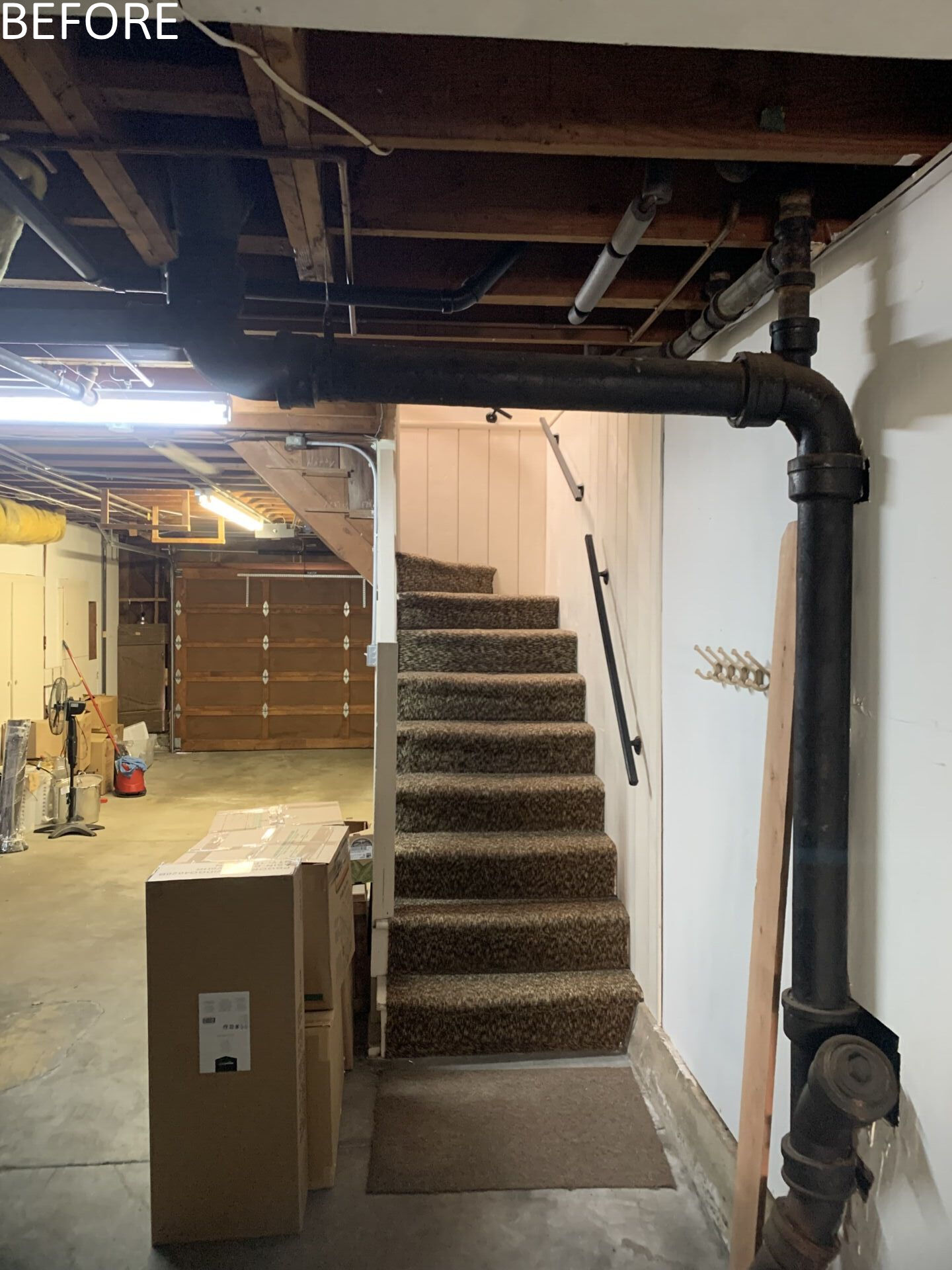 The original circulation did little to enhance light or connection between floors. Movement through the home felt secondary to the closed rooms it served.

The new central staircase transforms circulation into an architectural feature. A single piece glass guard maintains visual openness, while a sculptural metal handrail appears to float. Positioned beneath the skylight, the stair preserves sightlines and strengthens the sense of vertical continuity.