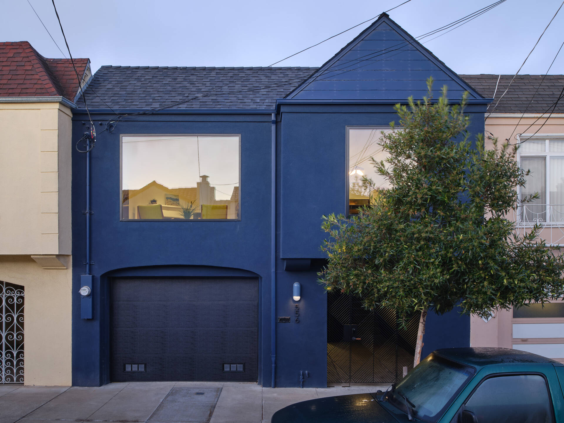 Budget constraints limited extensive facade changes, and the exterior showed little sign of the transformation inside. Strategic updates make a clear impact. Larger windows improve light, while a fresh coat of deep navy stucco ties the home to its surroundings. The exterior respects the neighborhood context while quietly signaling the contemporary interior within.