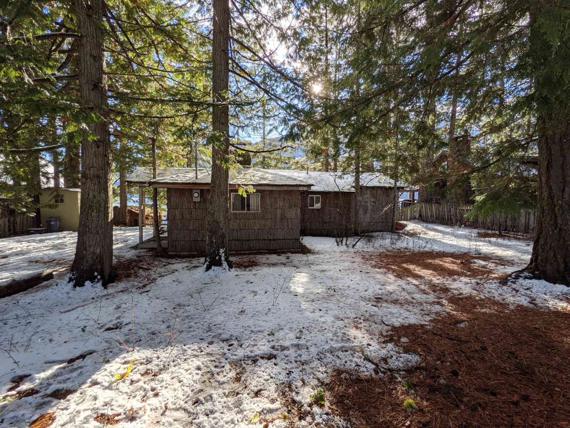 BEFORE - A modern lake house on Lake Wenatchee is built entirely around a preserved 1915 log cabin, turning history into the home’s centerpiece.