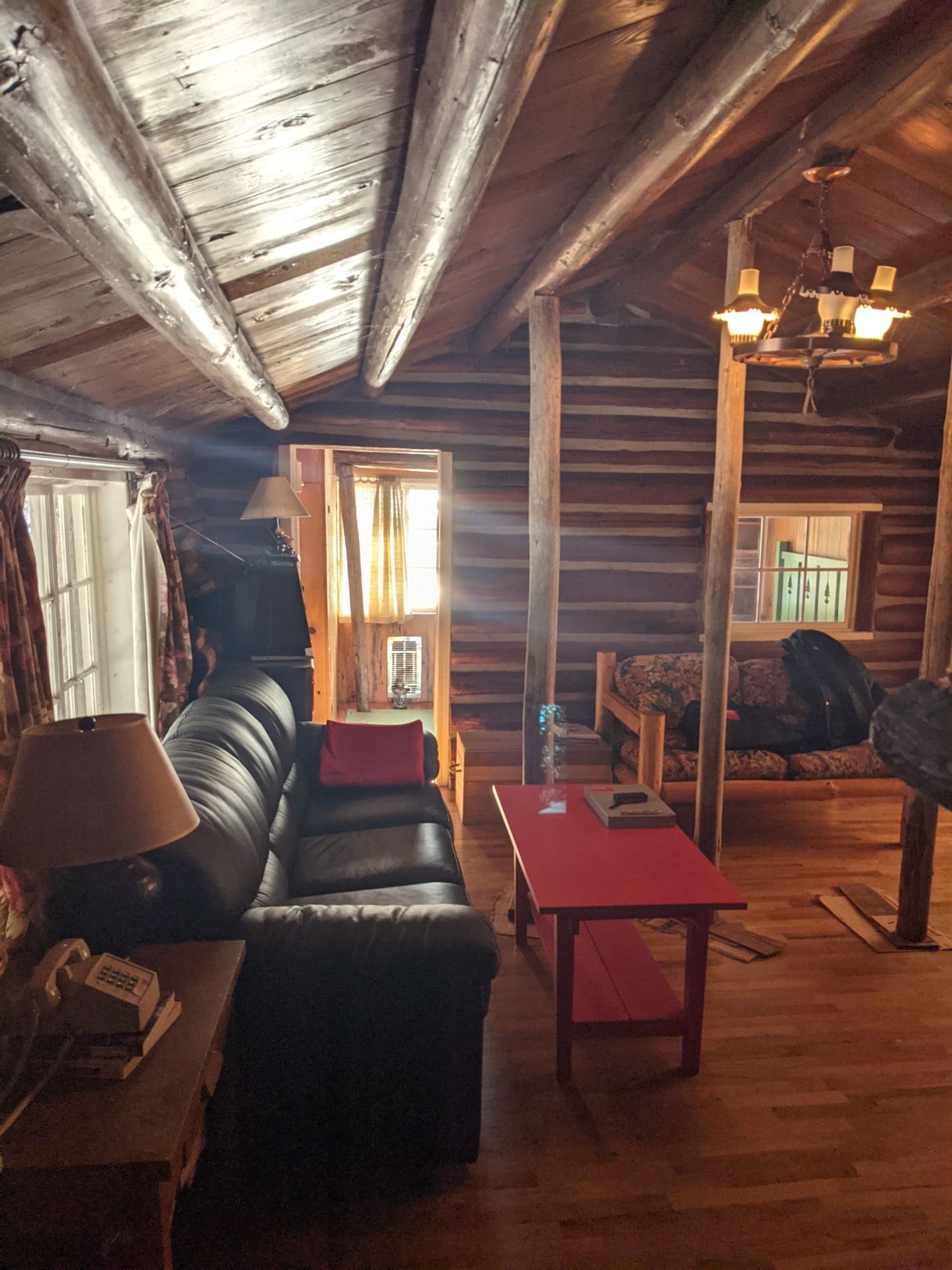 BEFORE - A modern lake house on Lake Wenatchee is built entirely around a preserved 1915 log cabin, turning history into the home’s centerpiece.