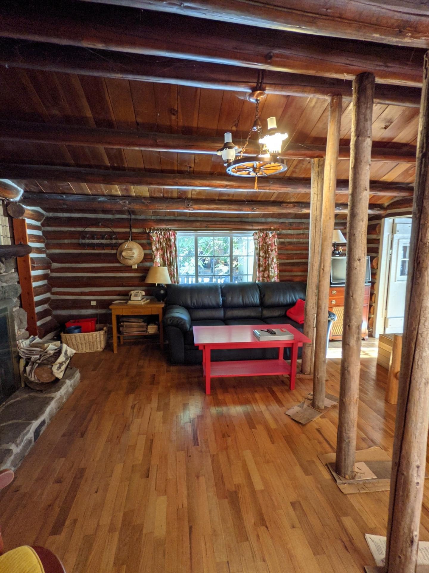 BEFORE - A modern lake house on Lake Wenatchee is built entirely around a preserved 1915 log cabin, turning history into the home’s centerpiece.