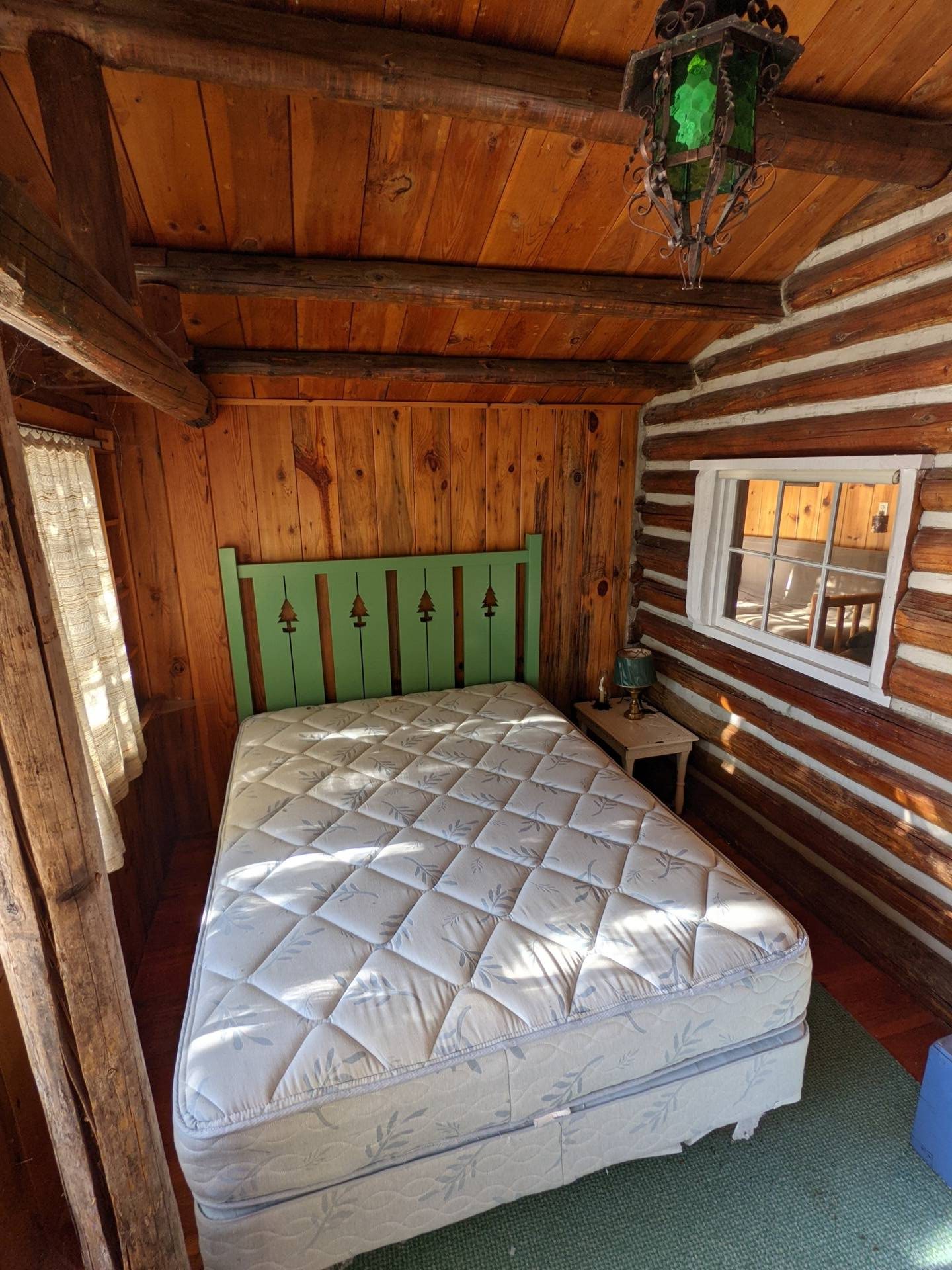 BEFORE - A modern lake house on Lake Wenatchee is built entirely around a preserved 1915 log cabin, turning history into the home’s centerpiece.