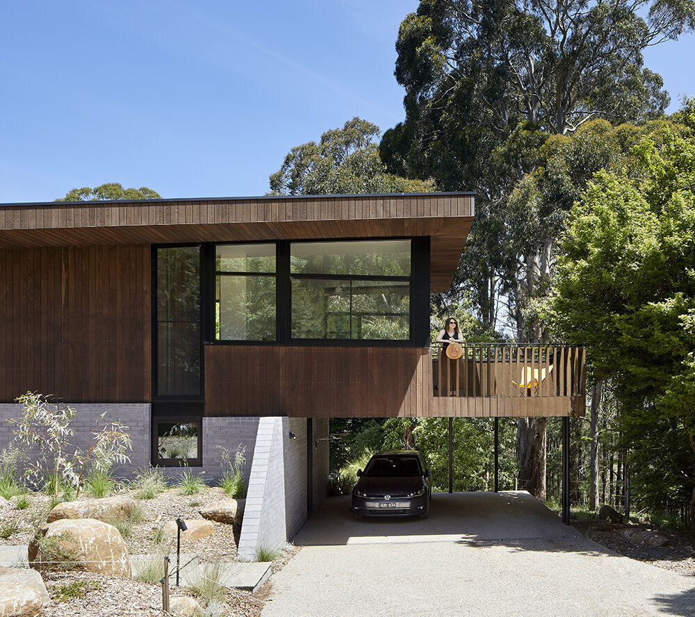 A sustainable split-level home in Melbourne designed for bushland living, featuring Ironbark cladding and innovative Timbercrete blockwork that blends strength with warmth.