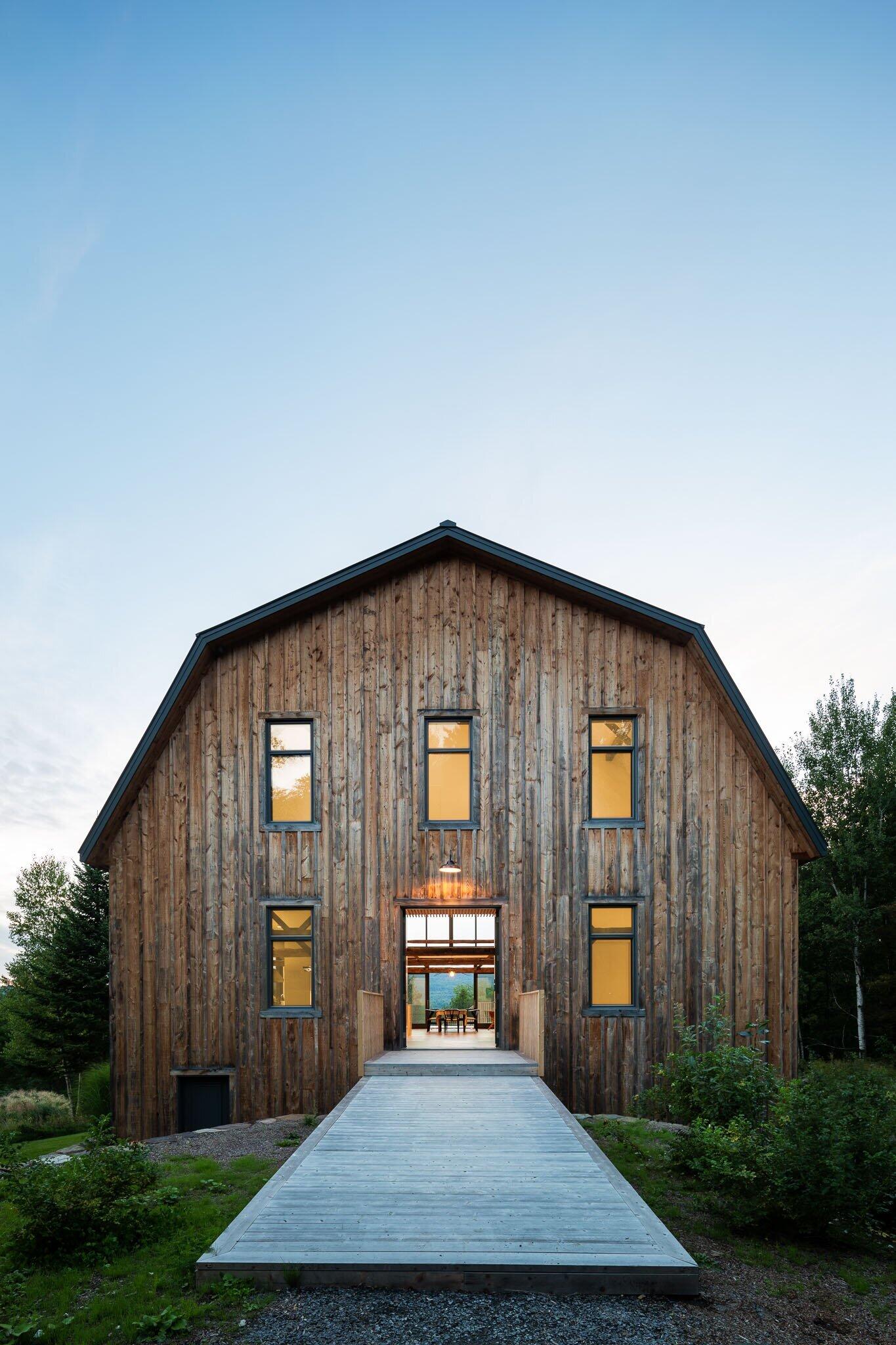 A 30 foot cathedral ceiling transforms the barn interior into a bright and open living space filled with original timber details.