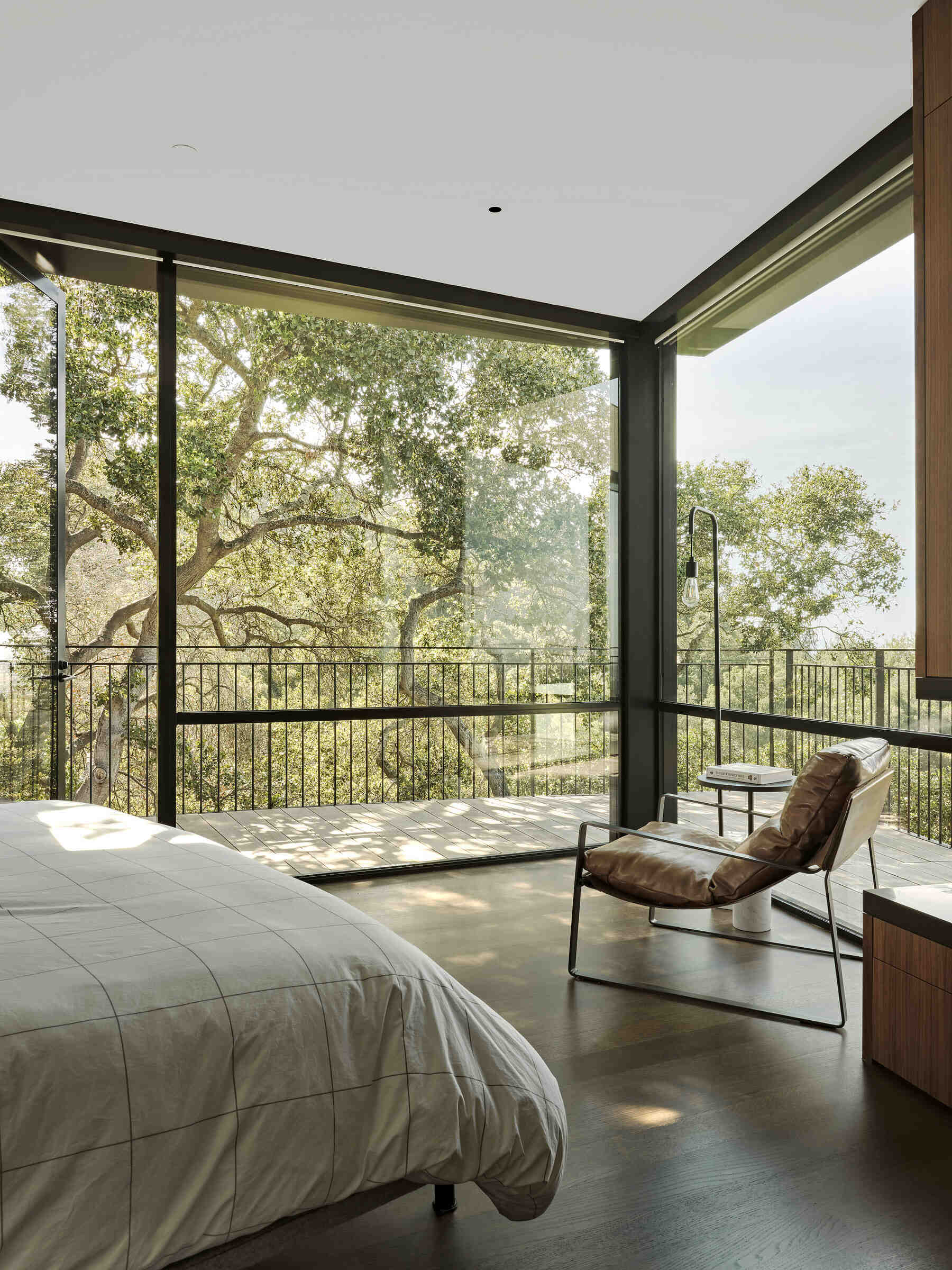 Each bedroom connects to the wrap around deck, giving every private space direct access to views and outdoor living.