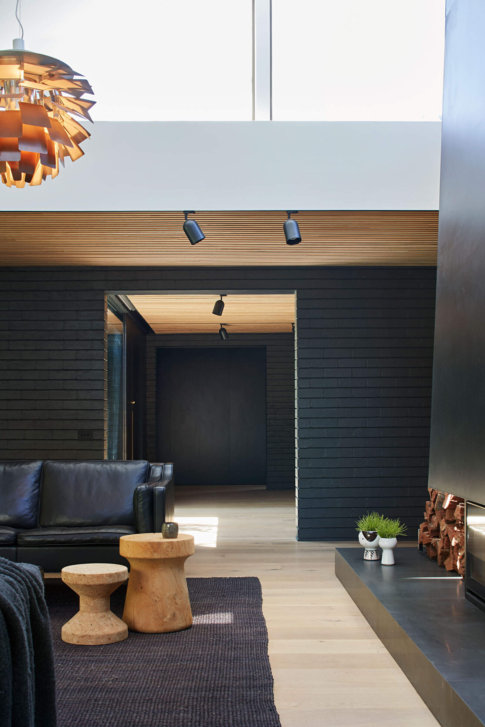 Exterior brickwork flows inside, shaping calm, honest interiors that celebrate imperfection and create a cohesive modern home.