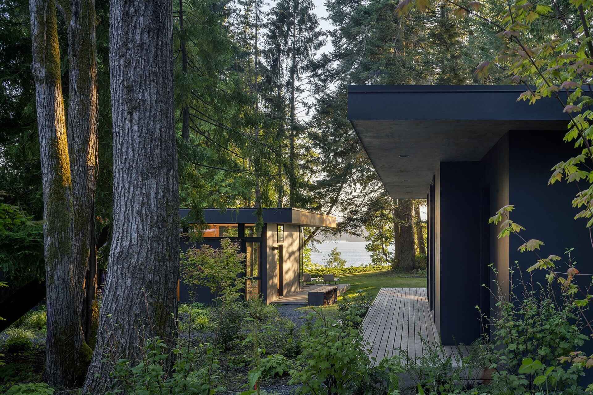 A hidden cluster of modern cabins tucked into the forest above Washington’s Hood Canal, designed to blend into the landscape and celebrate outdoor living.