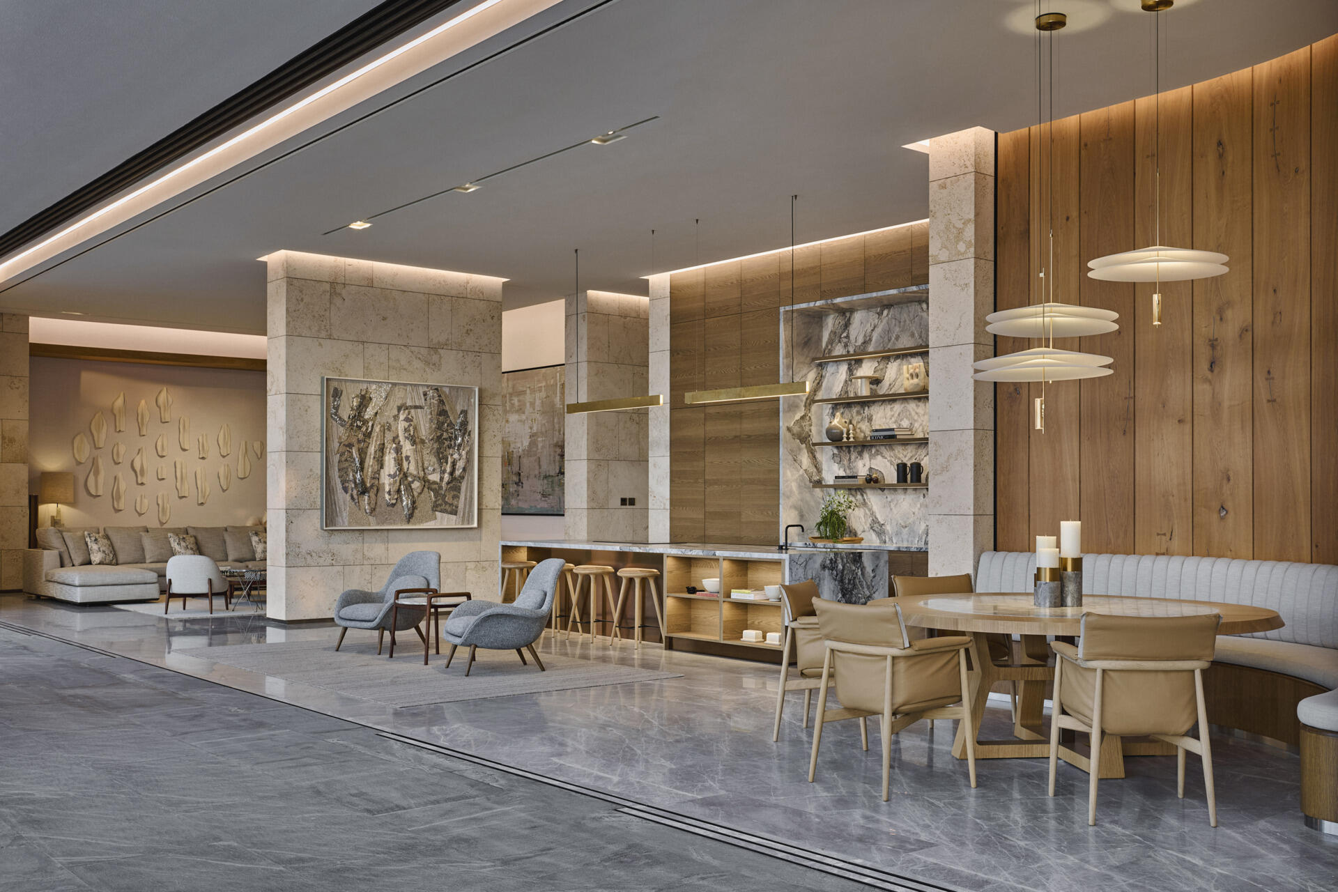 ARRCC interprets the beach setting through warm minimalism, layering timber, stone, leather and brushed metal. Bespoke OKHA furniture and soft neutral textiles create a tactile, refined living space that flows into kitchen and dining areas.