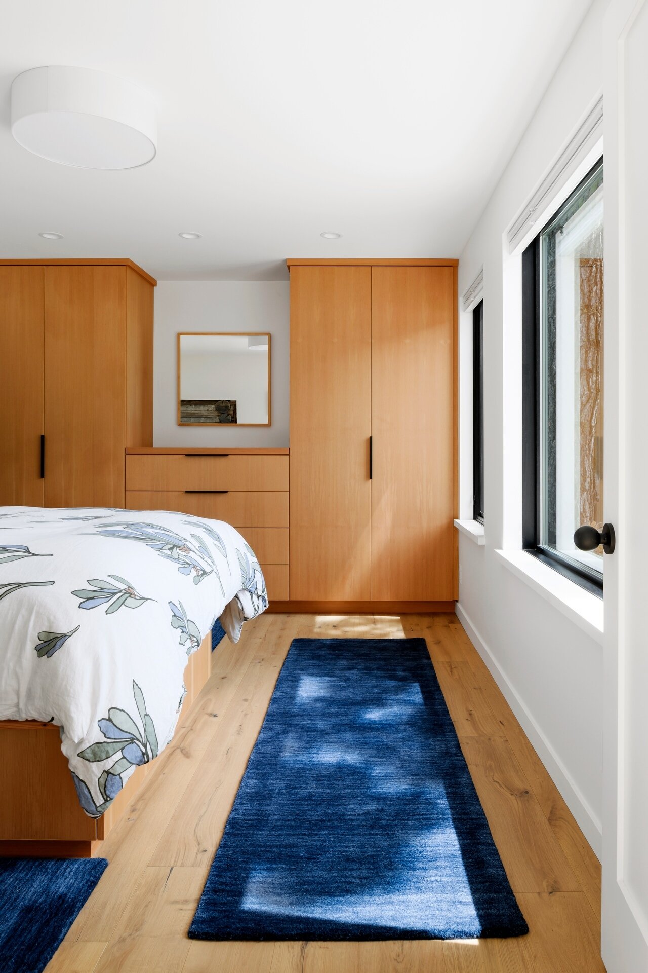 A modern bedroom with built-in closets.
