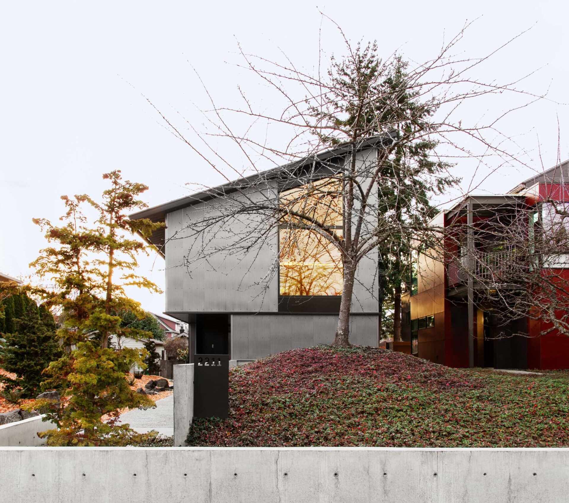 This Seattle home uses corrugated metal siding as its only exterior material, creating a bold yet minimalist look inspired by Japanese Shibui.