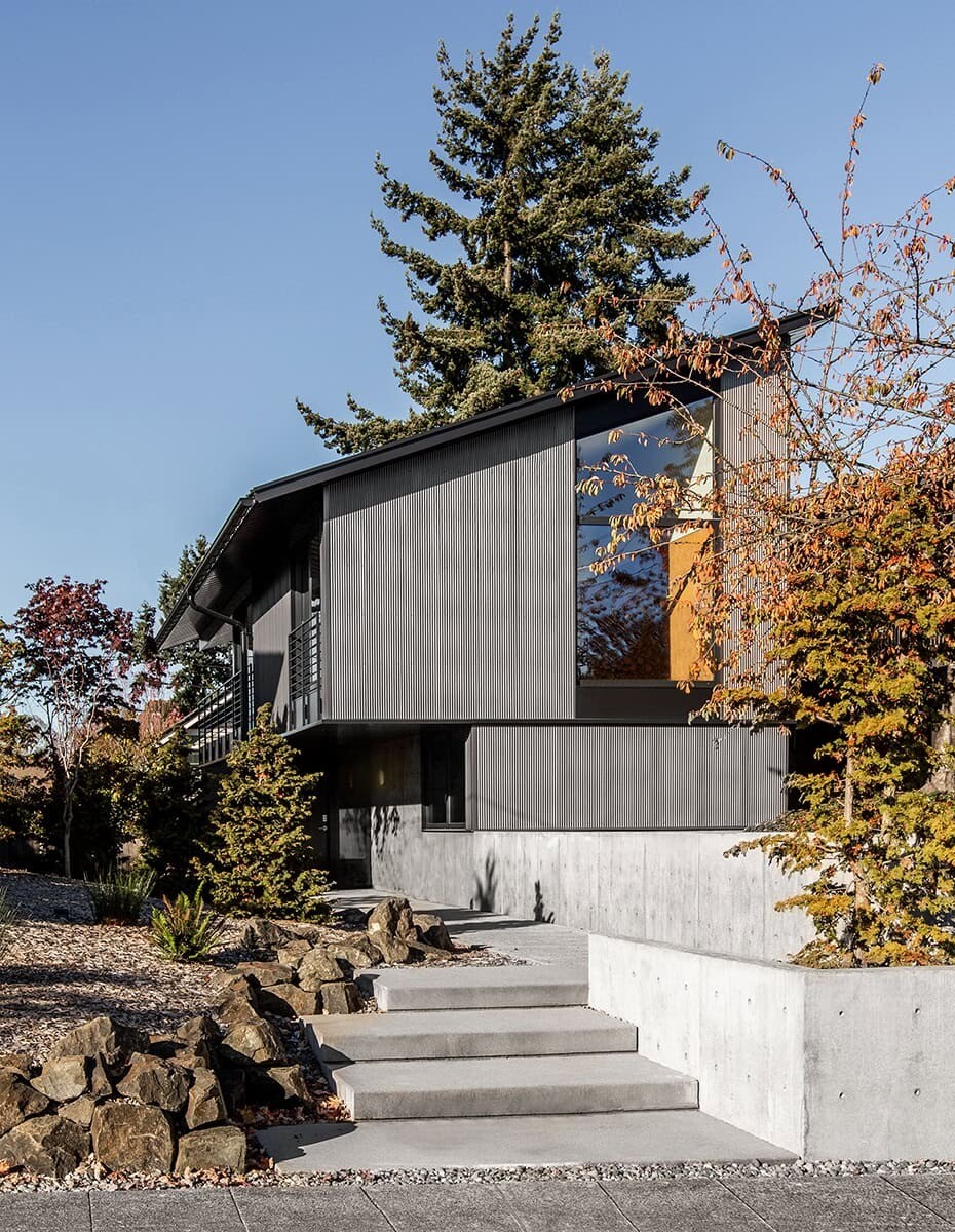 This Seattle home uses corrugated metal siding as its only exterior material, creating a bold yet minimalist look inspired by Japanese Shibui.