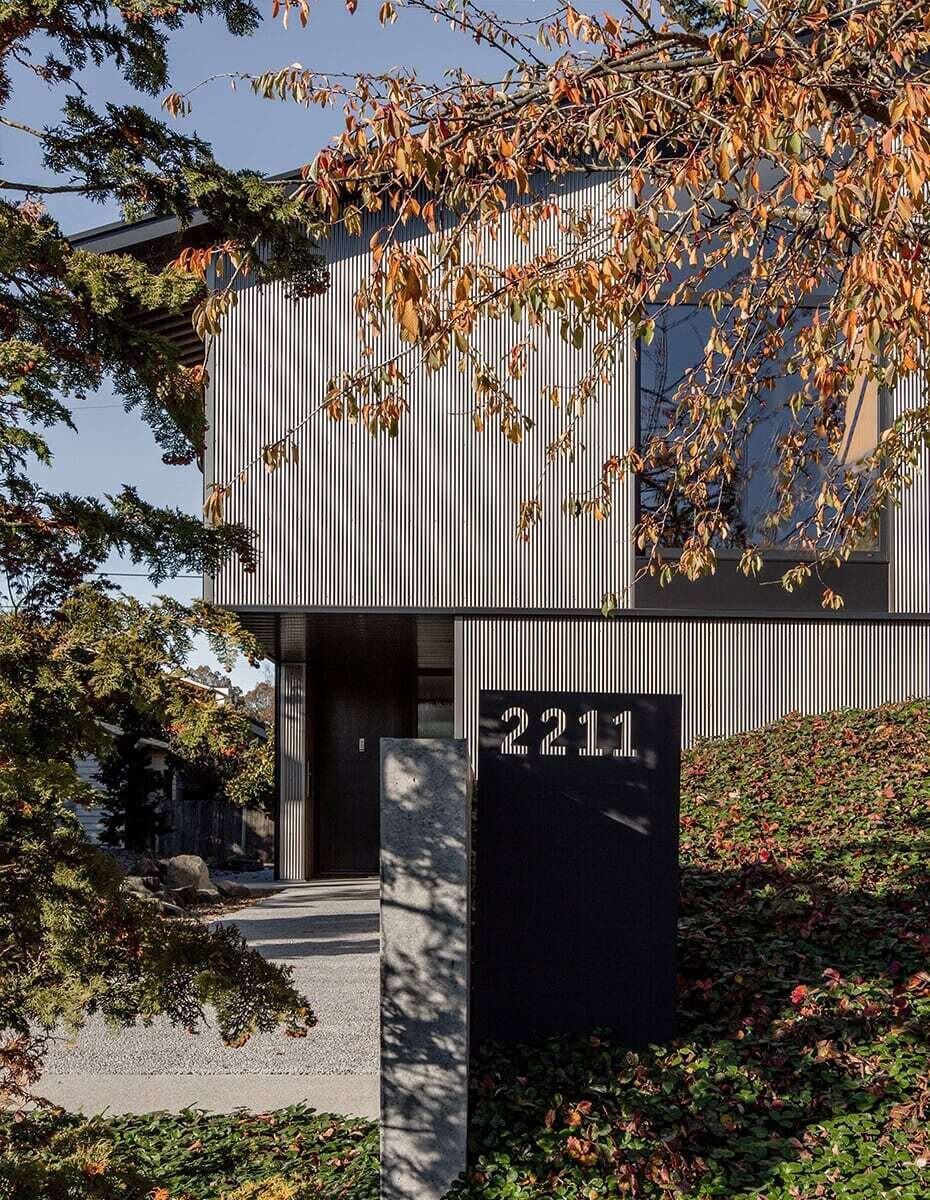 This Seattle home uses corrugated metal siding as its only exterior material, creating a bold yet minimalist look inspired by Japanese Shibui.