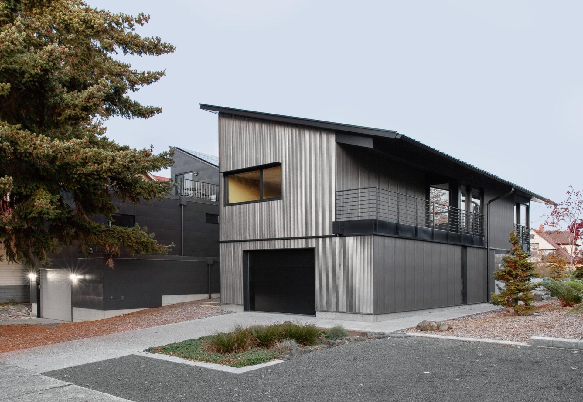This Seattle home uses corrugated metal siding as its only exterior material, creating a bold yet minimalist look inspired by Japanese Shibui.