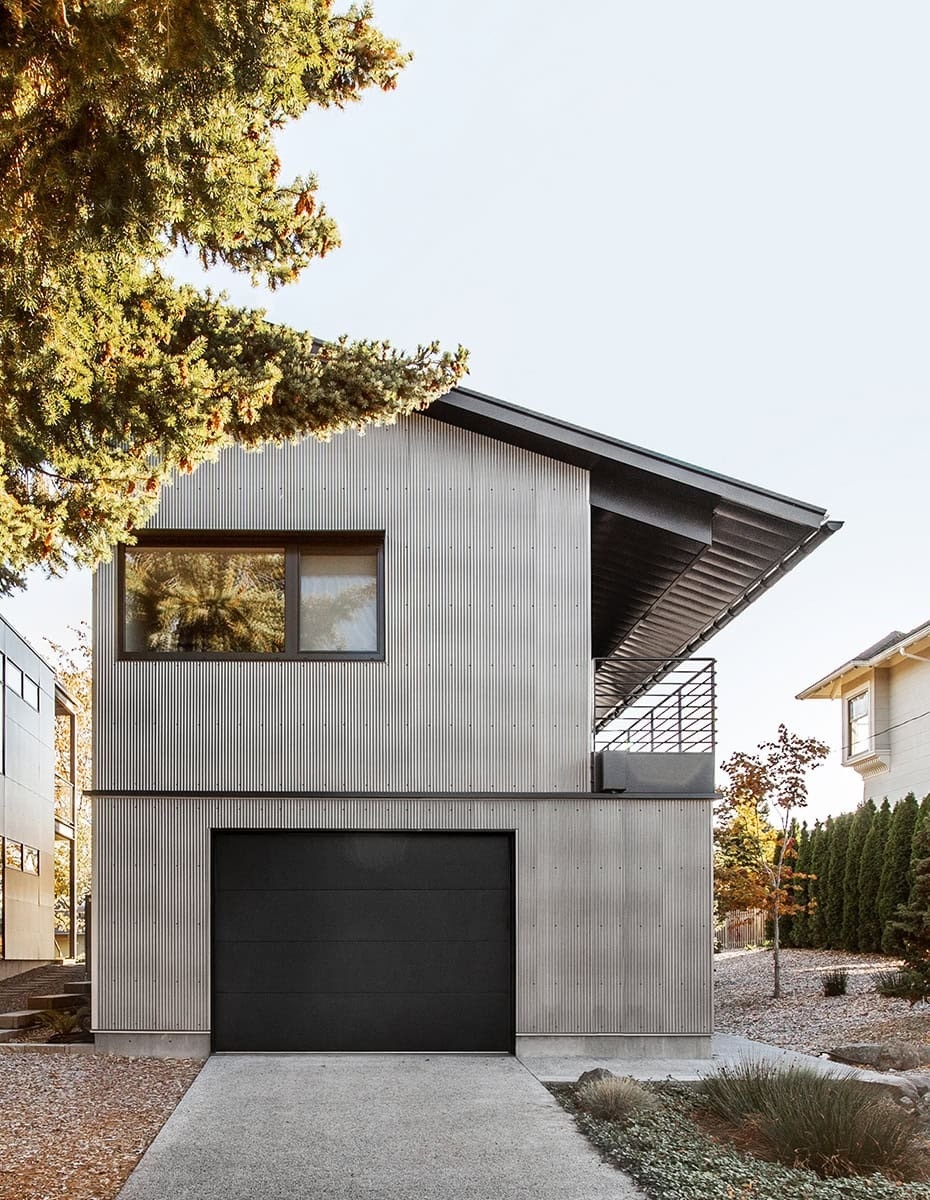 This Seattle home uses corrugated metal siding as its only exterior material, creating a bold yet minimalist look inspired by Japanese Shibui.