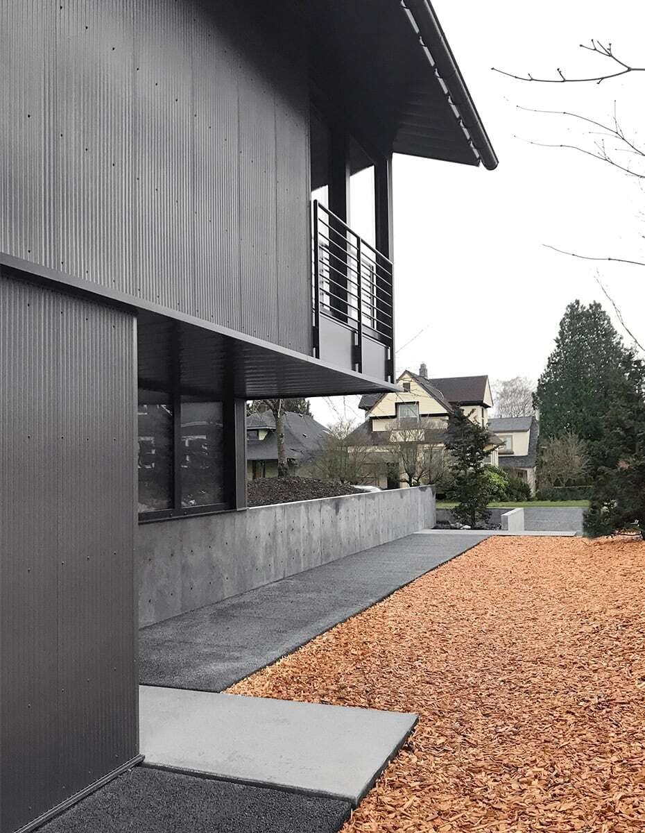 This Seattle home uses corrugated metal siding as its only exterior material, creating a bold yet minimalist look inspired by Japanese Shibui.