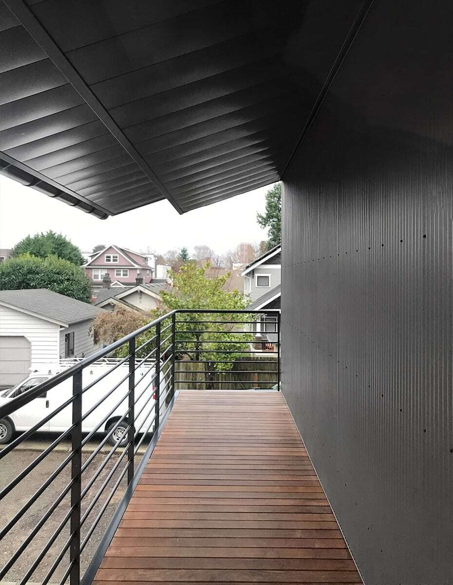 This Seattle home uses corrugated metal siding as its only exterior material, creating a bold yet minimalist look inspired by Japanese Shibui.