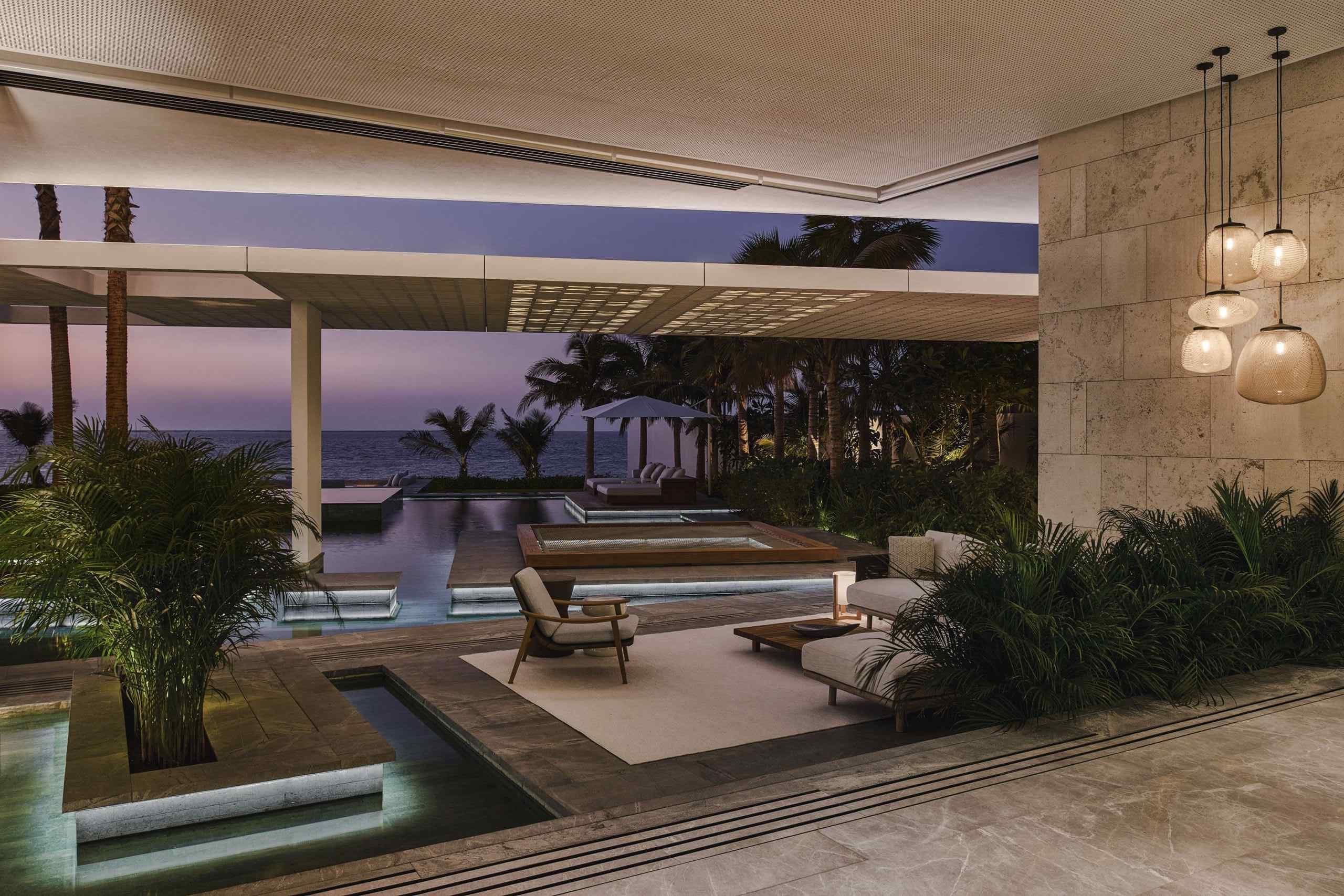 Aligned with coastal views, the swimming pool anchors the garden edge in a restrained composition of water, stone and sky. The connection to the Arabian Sea remains uninterrupted.