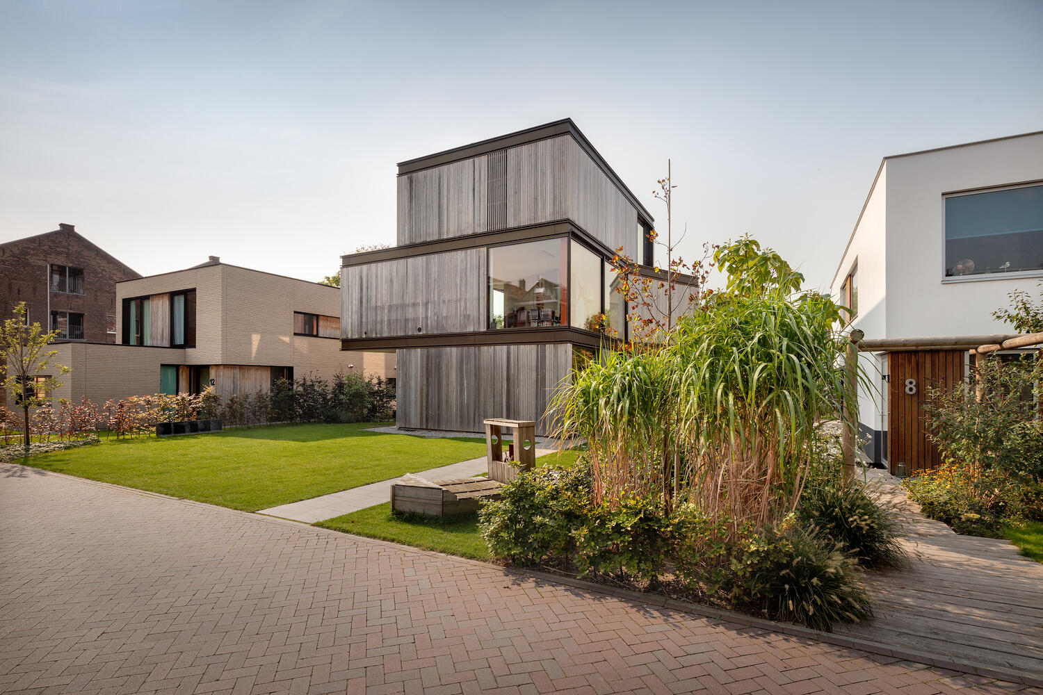 This modern villa in Schiedam features three stacked rectangular floors, with the middle level rotated to create a striking angular form. Wood, metal and glass reference the site’s industrial past while adding a subtle maritime touch.