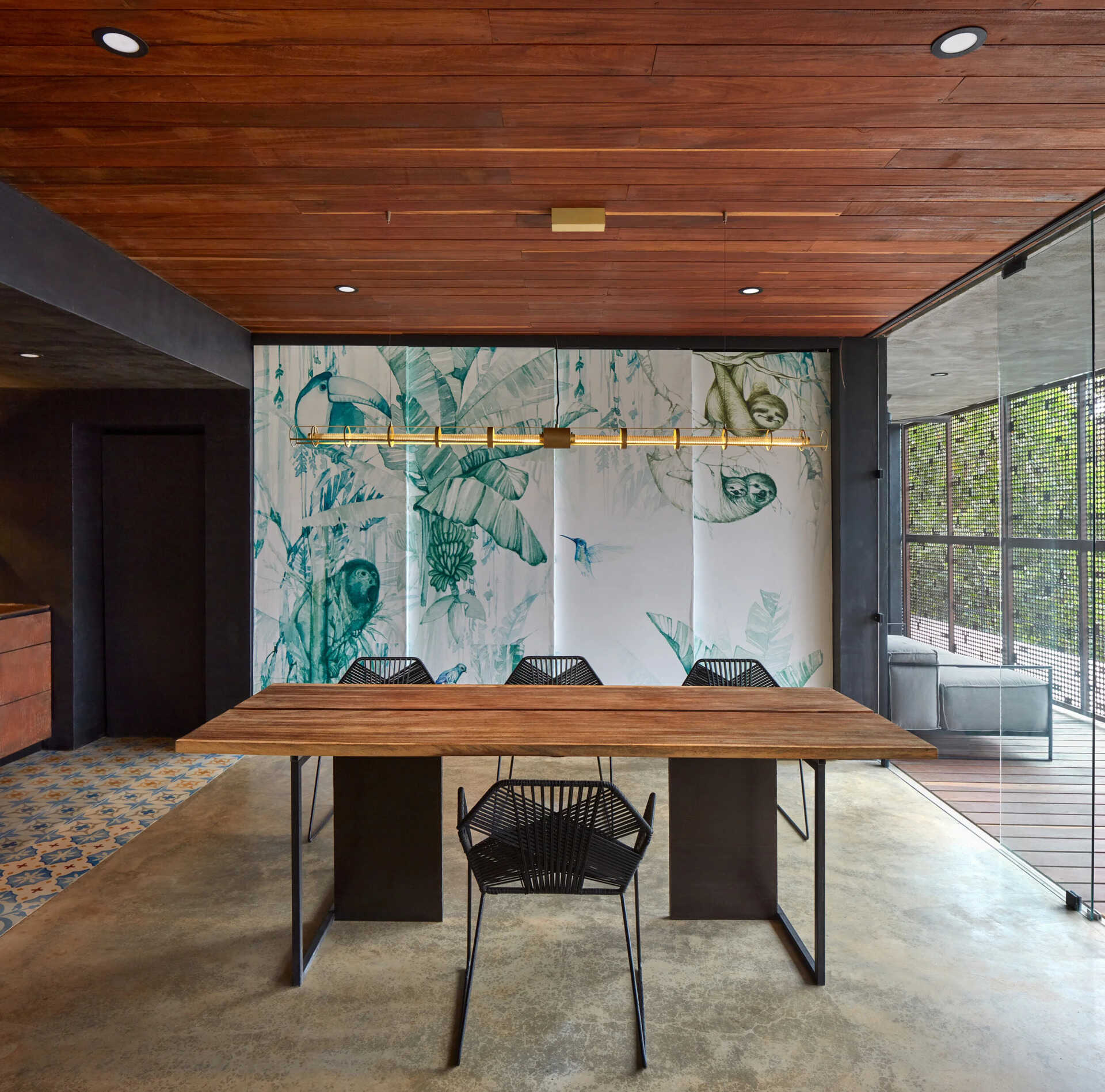 Two additional glass wrapped bedrooms feature colorful artistic screens that slide closed for privacy when needed.