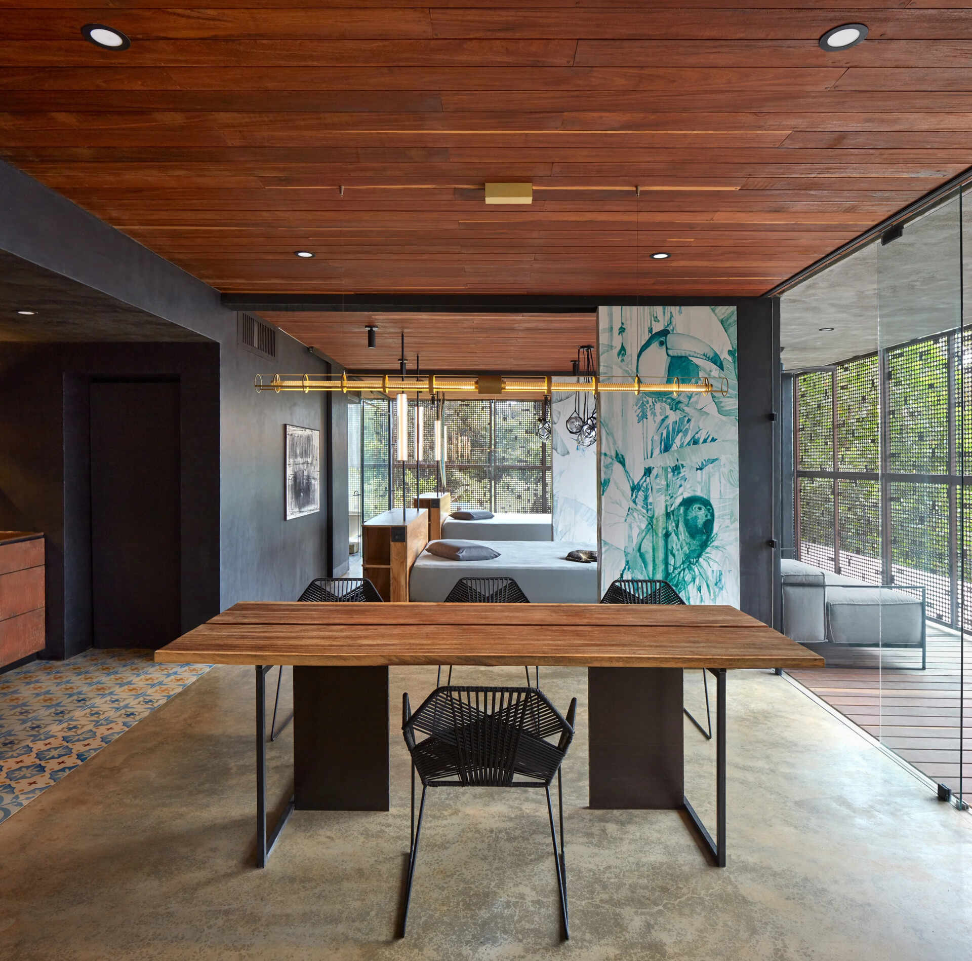 Two additional glass wrapped bedrooms feature colorful artistic screens that slide closed for privacy when needed.