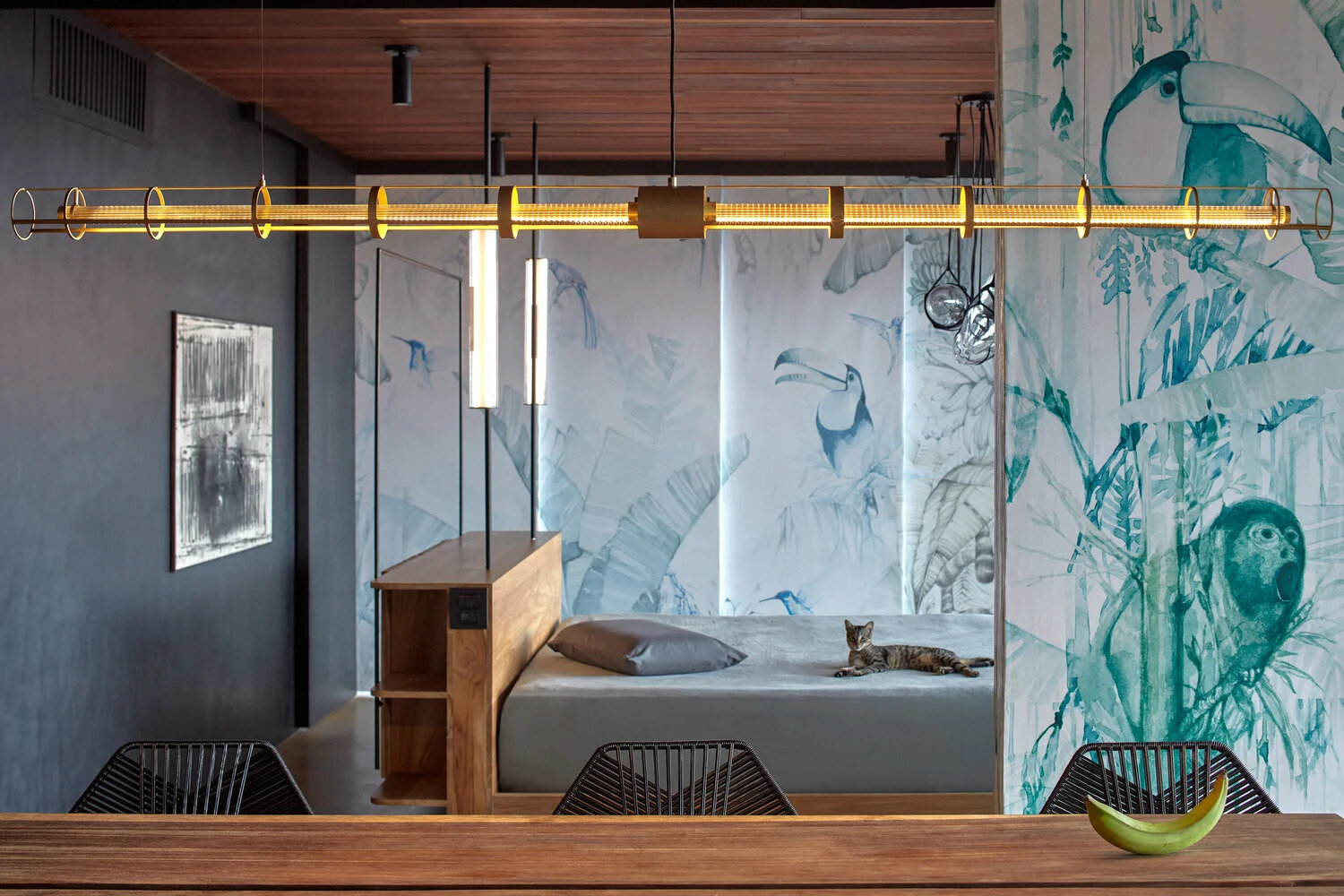 Two additional glass wrapped bedrooms feature colorful artistic screens that slide closed for privacy when needed.