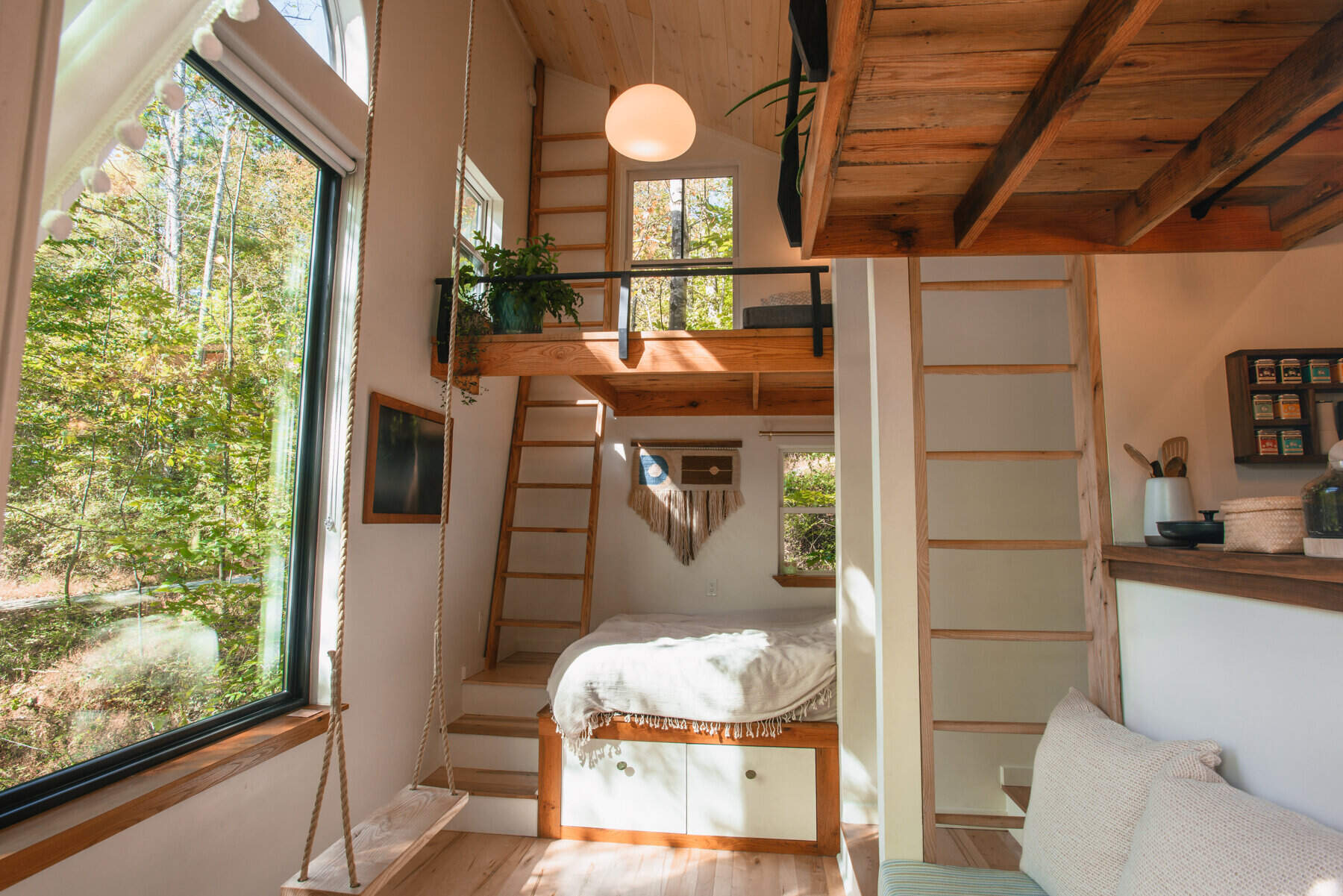 From a breakfast alcove to a tea loft and entertainment loft, this tiny house is packed with clever nooks that make every inch count.
