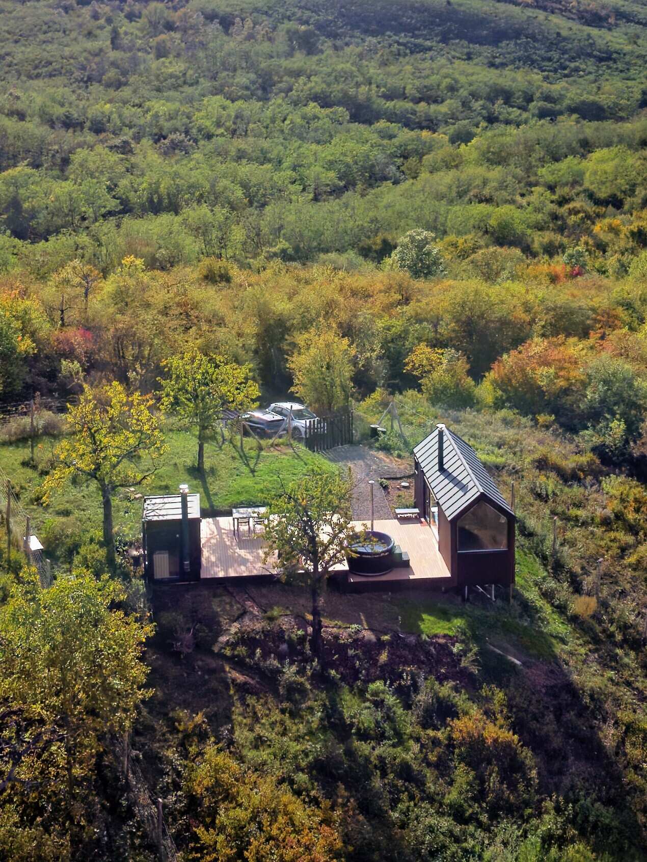 Set on a rolling hillside just outside Budapest, this compact cabin is designed to frame the landscape, not compete with it. With a minimal footprint and partially prefabricated structure, it sits lightly on the terrain while maximizing every view.