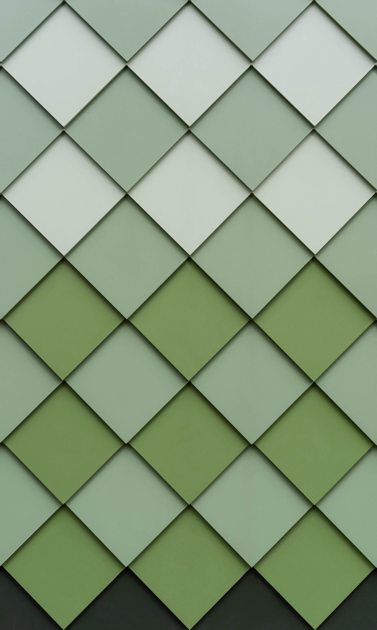 A small green-shingled studio sits tucked in a South West London backyard, its octagonal walls and hexagonal roof blending geometry with garden surroundings while hinting at the playful space within.