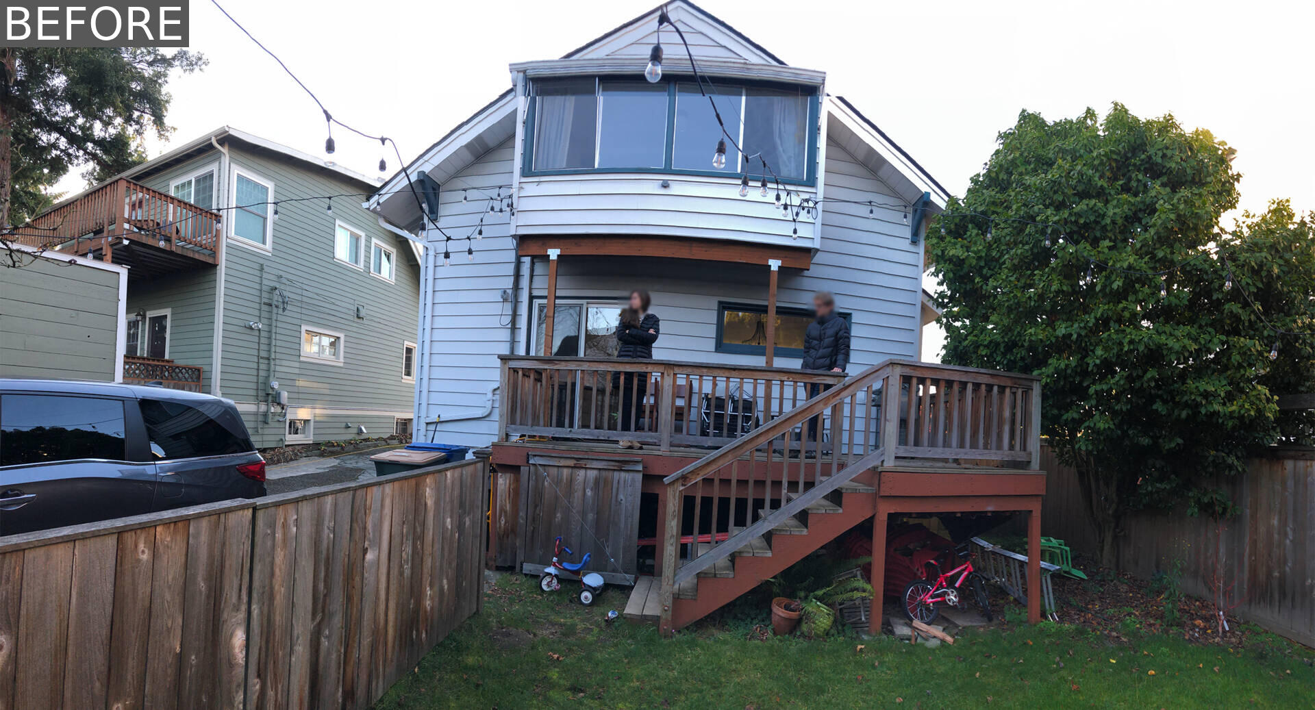 BEFORE RENOVATION - A compact backyard transforms into a layered outdoor retreat with a firepit, built-in seating, and a playful corner window connection.