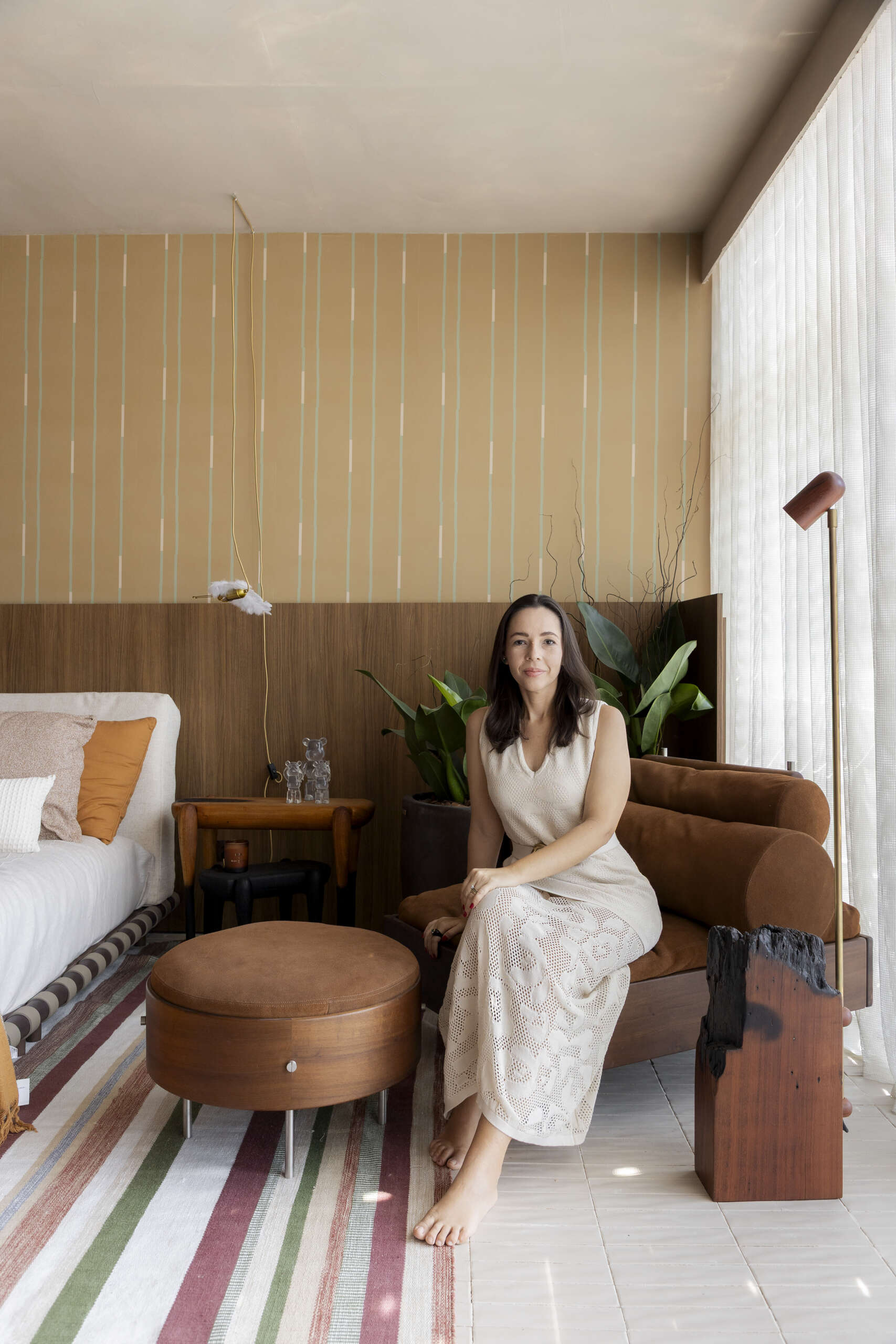 Warm tones transform the bedroom into a calm, restful space, creating a clear contrast from the social areas.