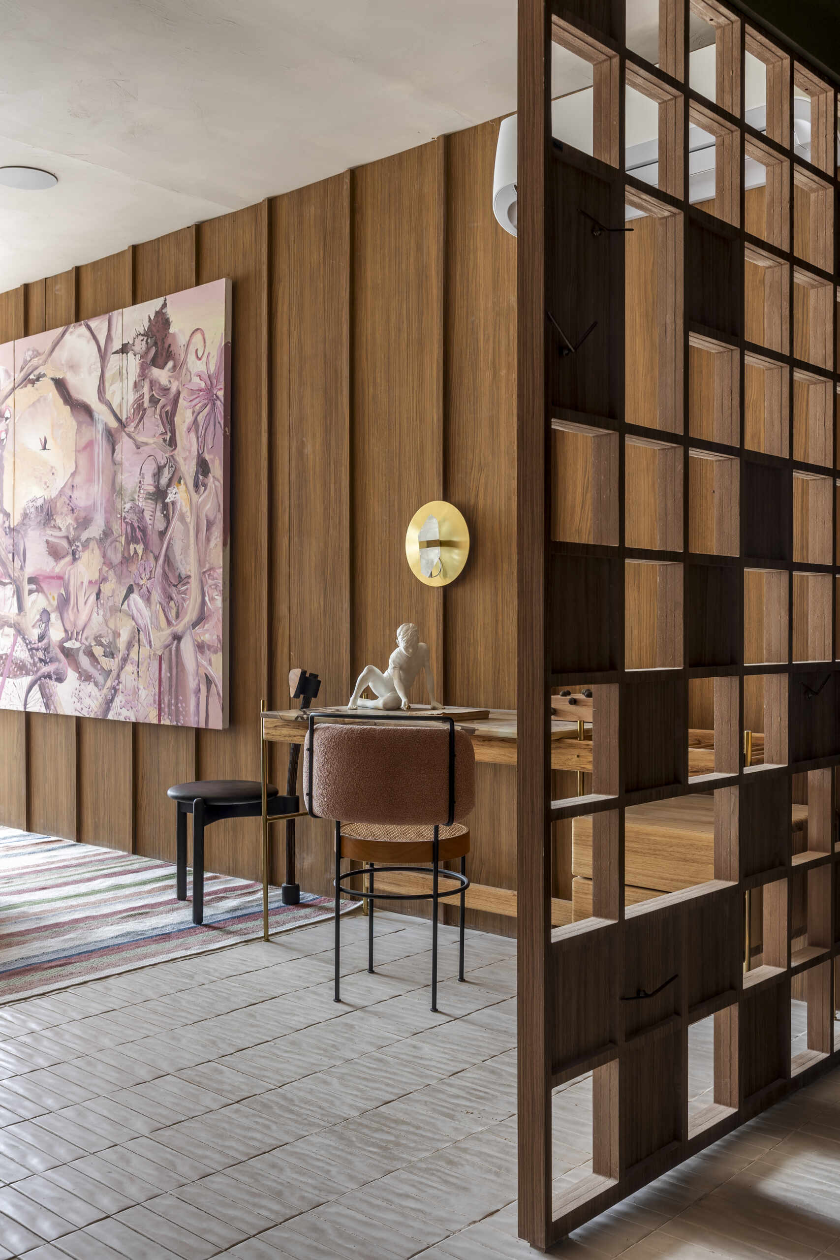 Warm tones transform the bedroom into a calm, restful space, creating a clear contrast from the social areas.