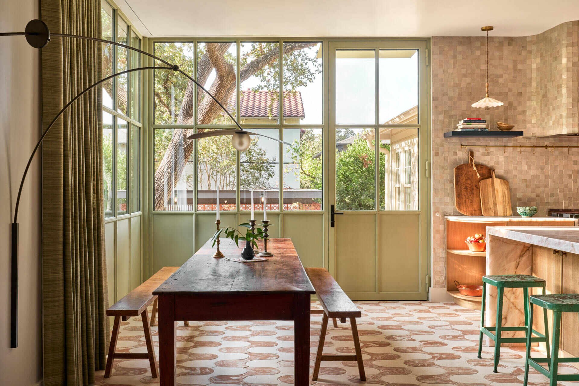 In the dining room, soft earth tones and natural light create an open, relaxed space that flows seamlessly from the living area.