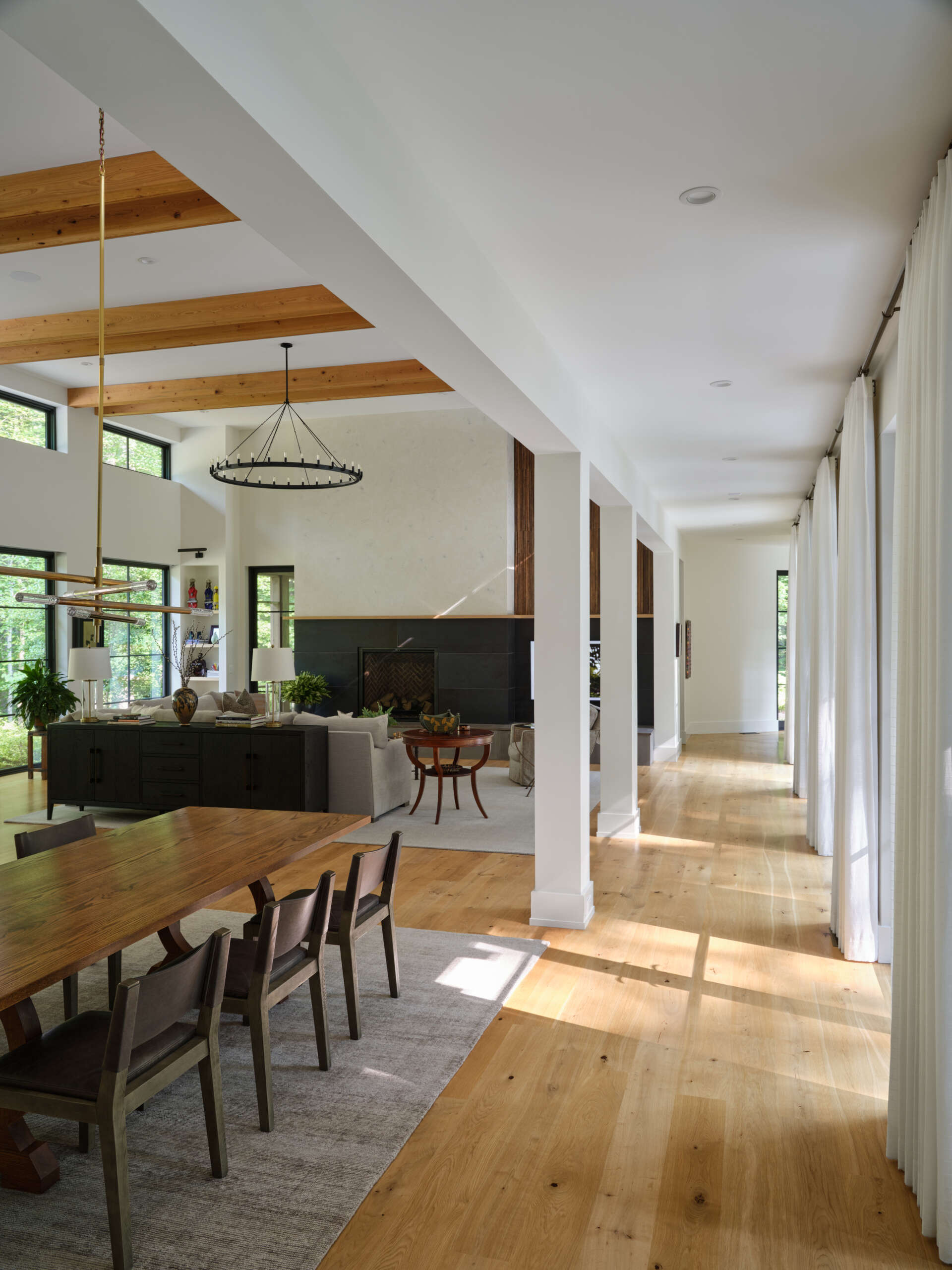An open dining space filled with natural light, seamlessly connected to both kitchen and living areas.