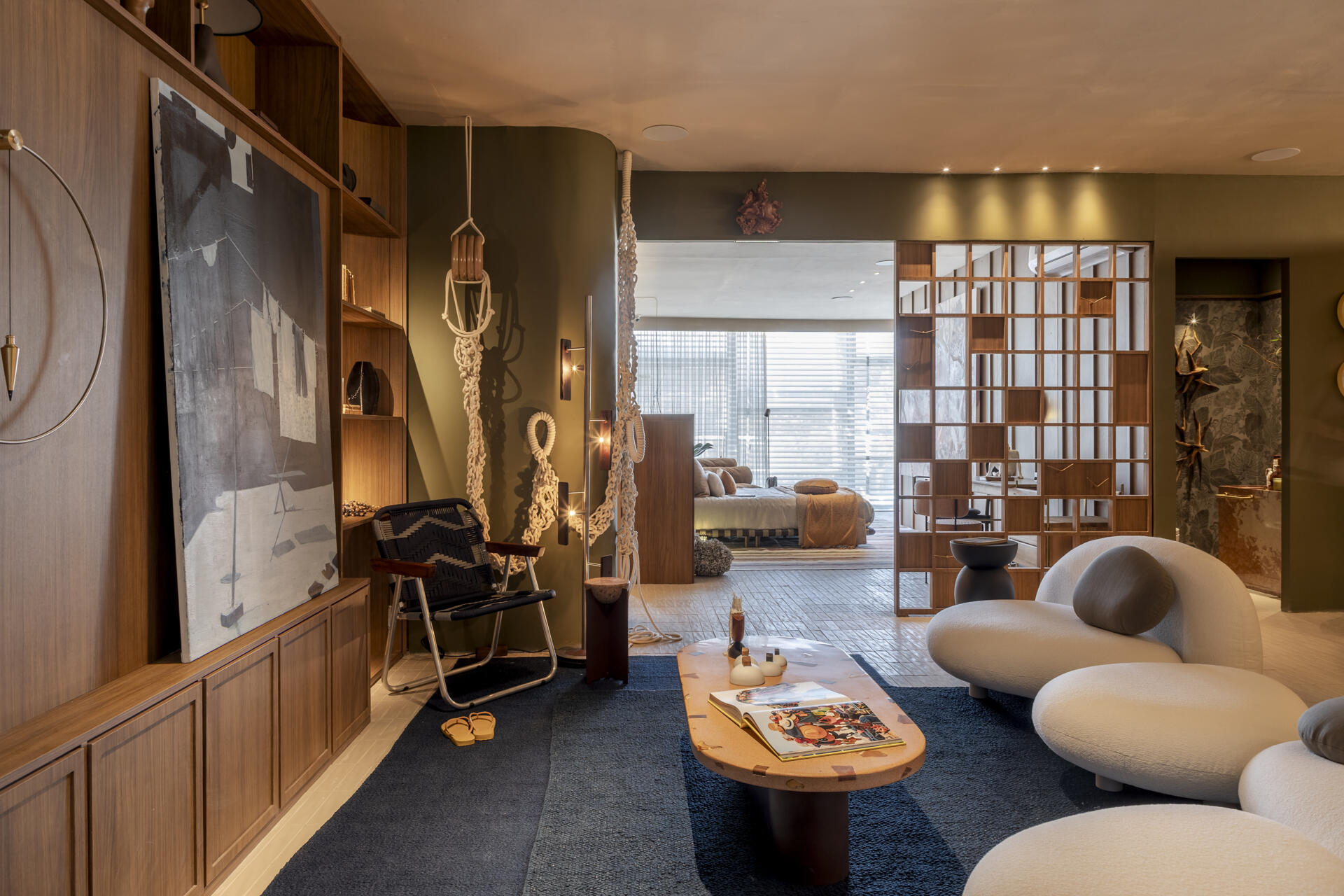 Warm tones transform the bedroom into a calm, restful space, creating a clear contrast from the social areas.