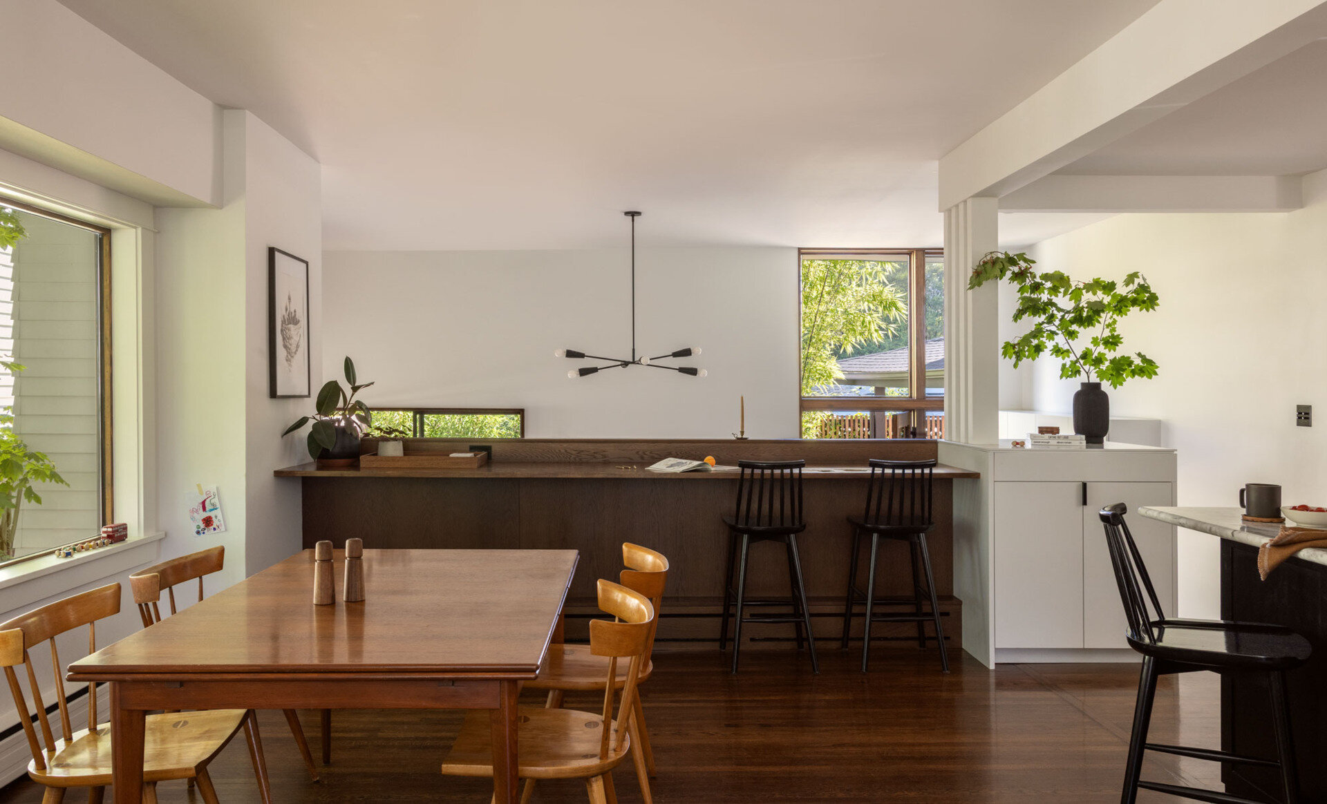 An elevated kitchen and dining space is reimagined for better flow, now connecting seamlessly to the rest of the home and outdoors.