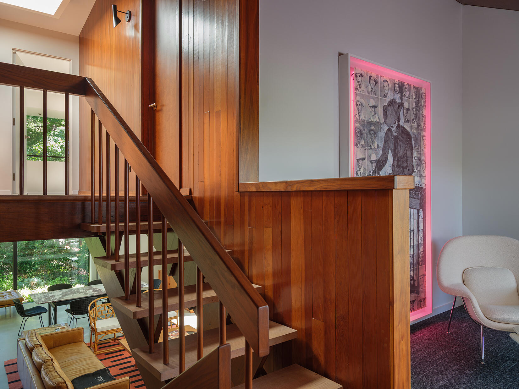 At the stairs, the original structure is restored, linking all five levels and reinforcing the home’s split-level design.