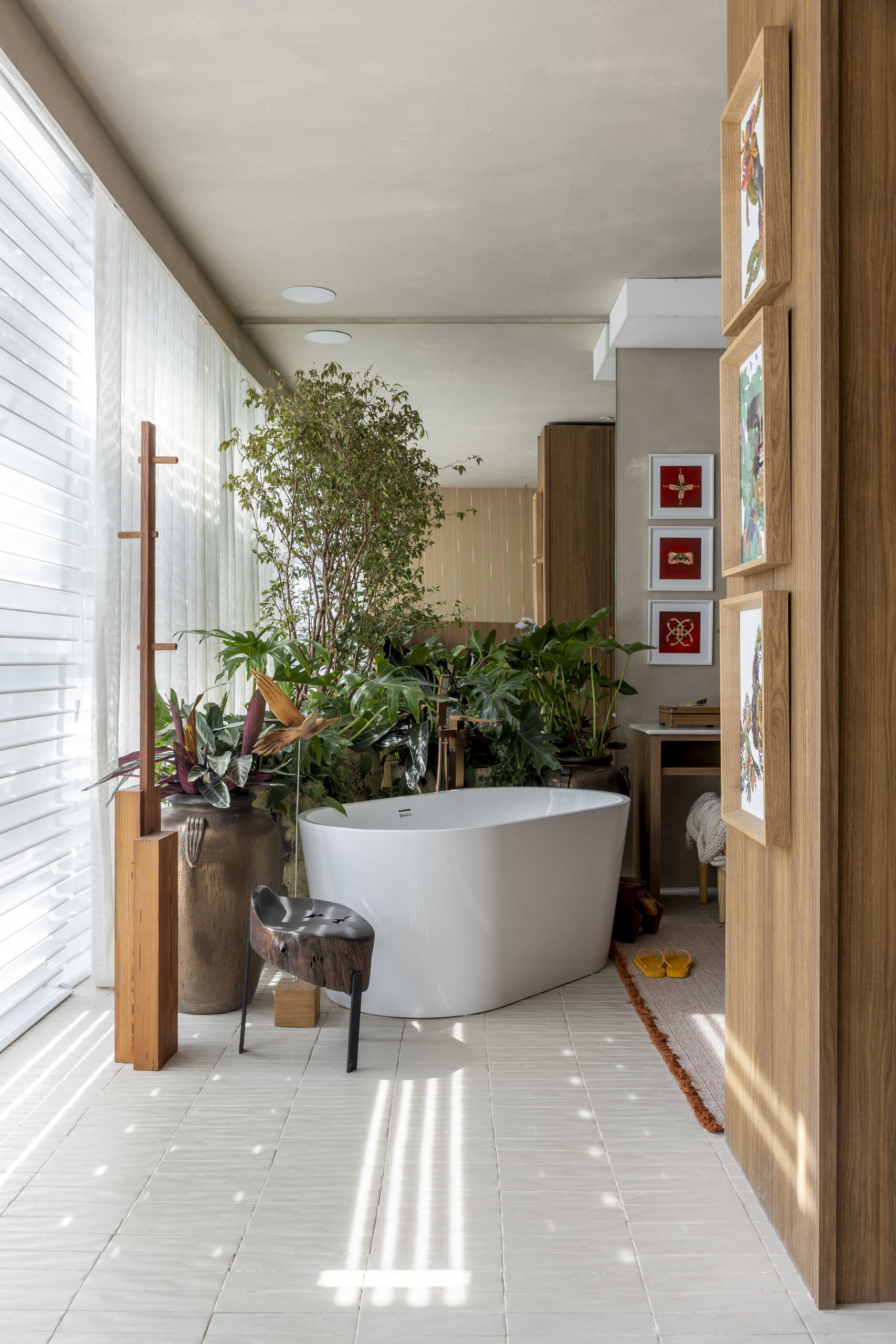 A warm, refined bathroom that continues the softer palette of the private areas for a cohesive feel.