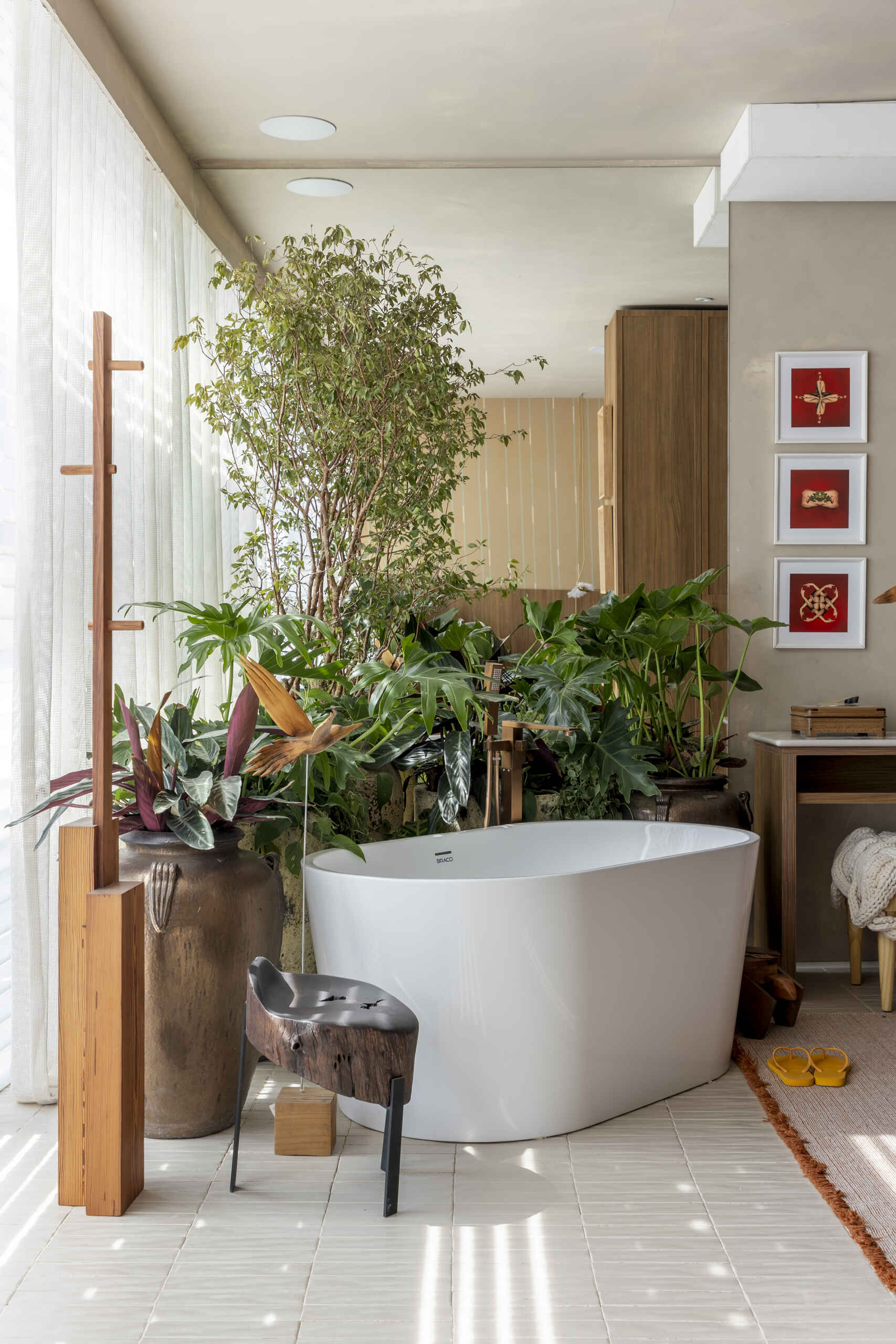 A warm, refined bathroom that continues the softer palette of the private areas for a cohesive feel.