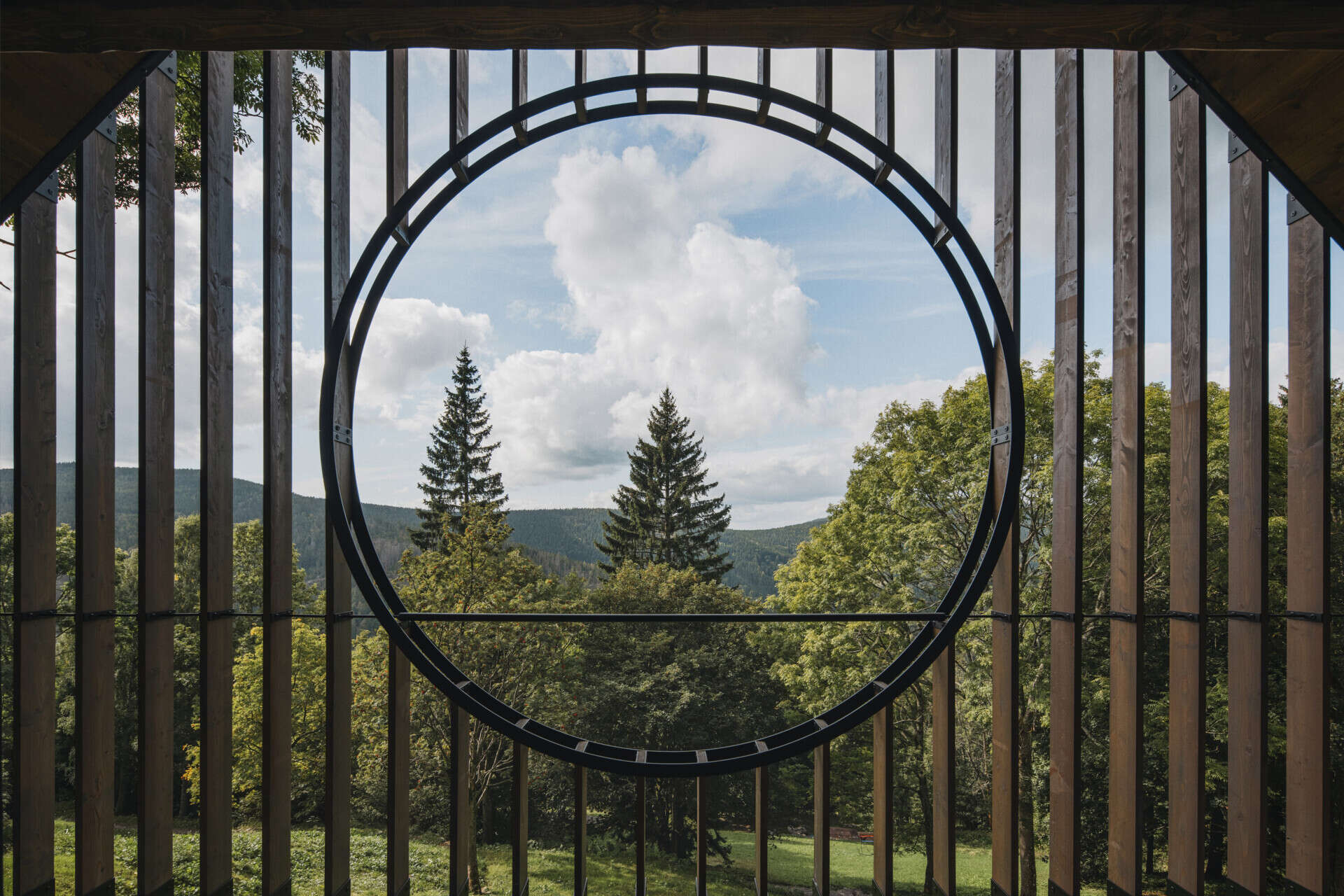 Mountain cottage gable bedrooms and social spaces frame expansive ridgeline views while keeping cozy scale.