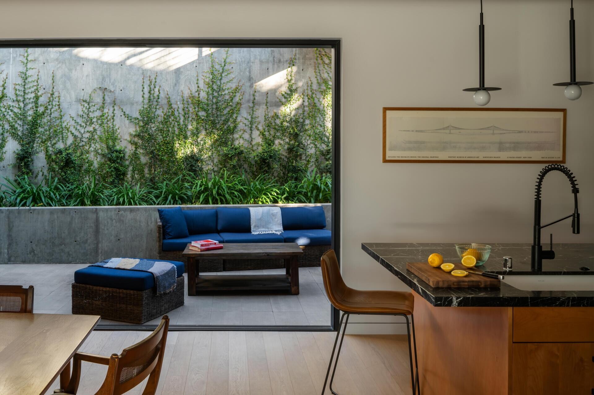 The dining and kitchen areas are located behind the living room with each space leading naturally into the next.