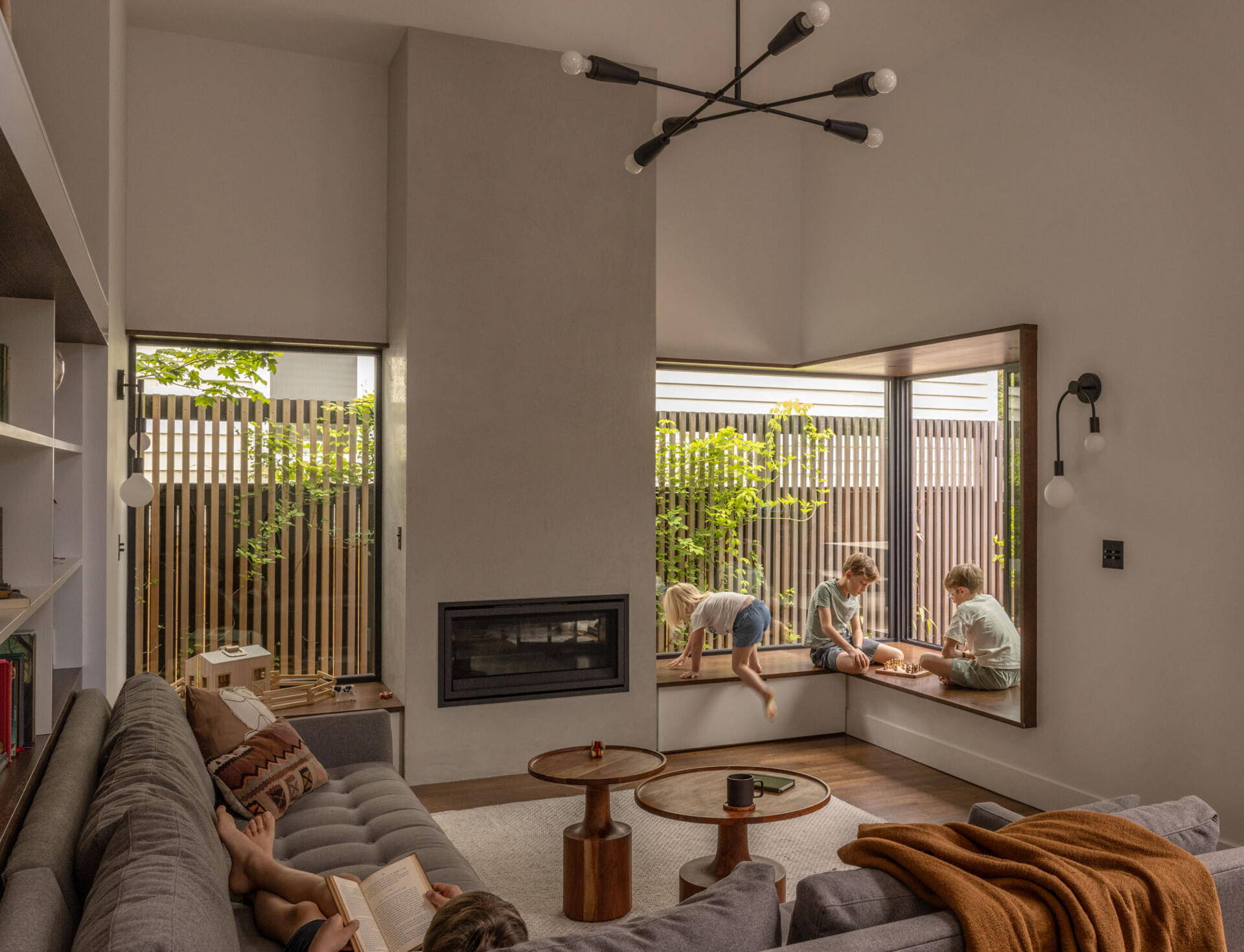 A sunken family room becomes the heart of the home, offering a cozy yet open space for everyday gathering and relaxation.