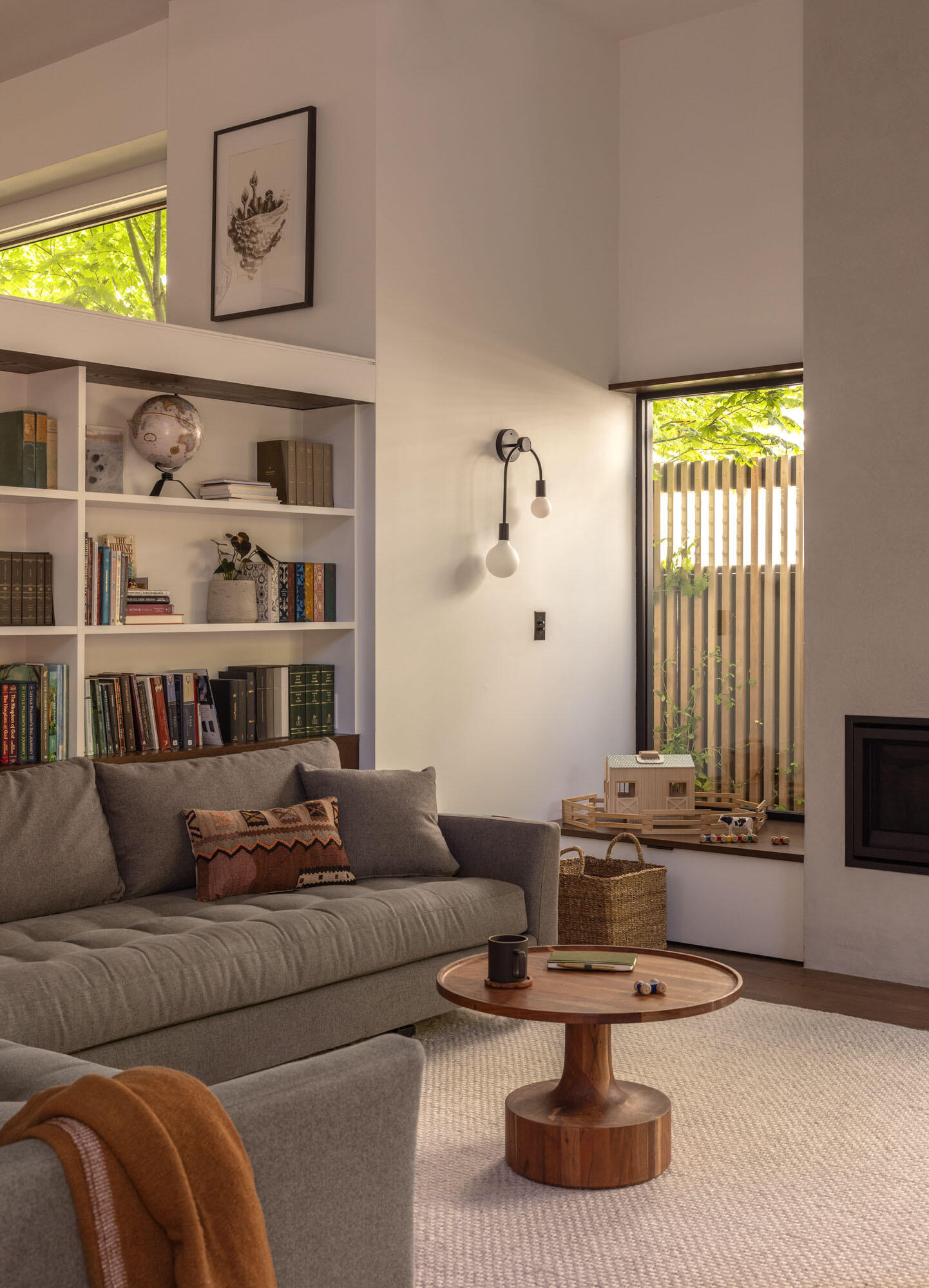 A sunken family room becomes the heart of the home, offering a cozy yet open space for everyday gathering and relaxation.