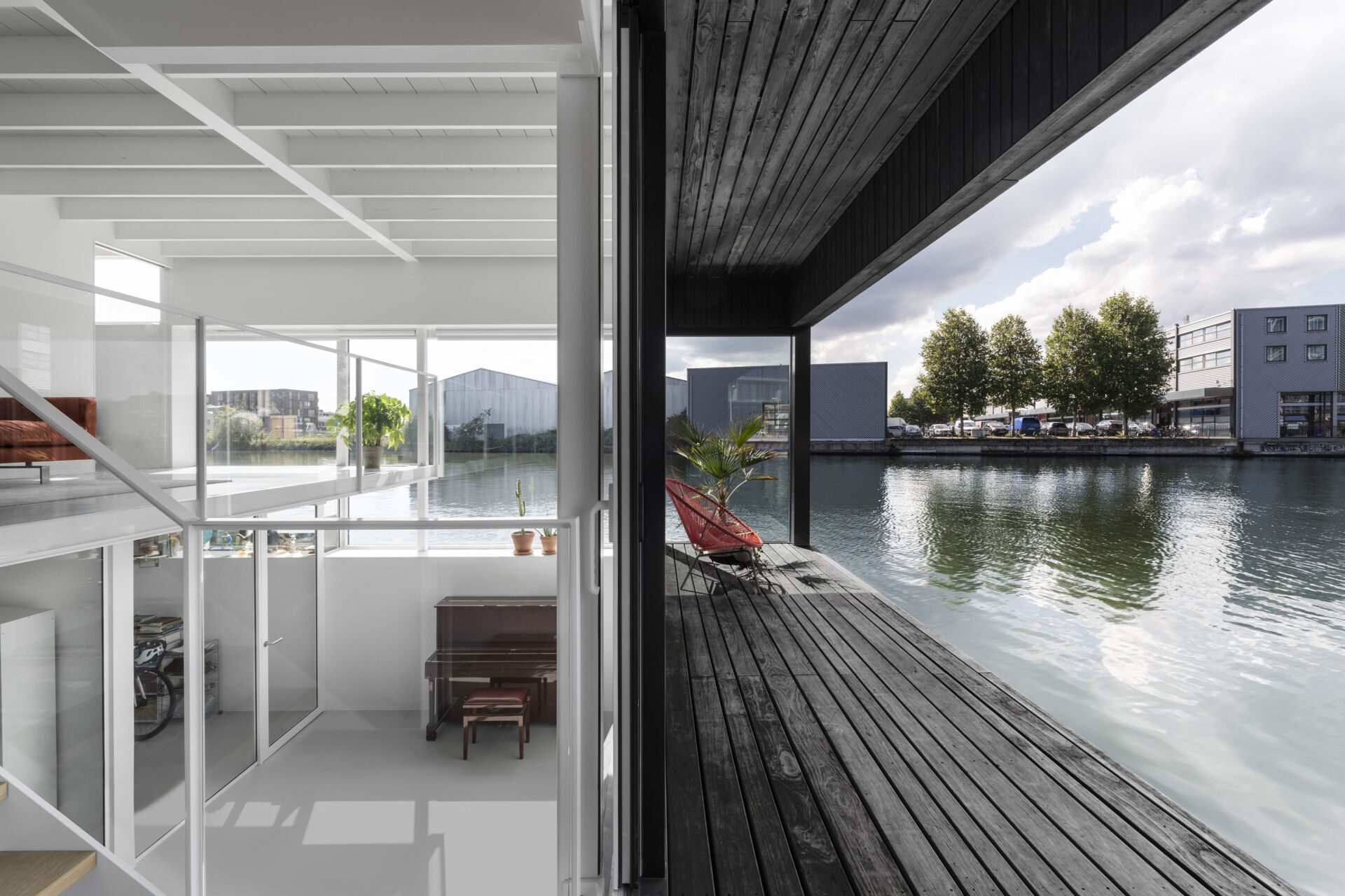 A small covered deck sits just above the water, offering uninterrupted views and a quiet outdoor moment.