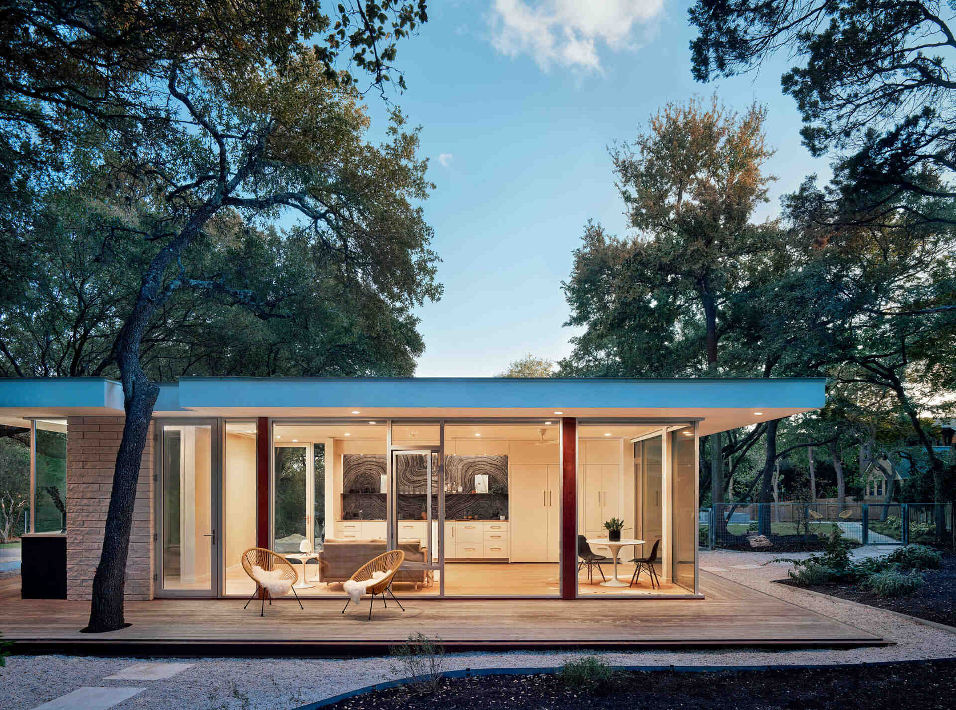 A compact glass guest house in Austin designed by Matt Garcia Design shows how thoughtful architecture can make a small 540 square foot ADU feel open and bright.