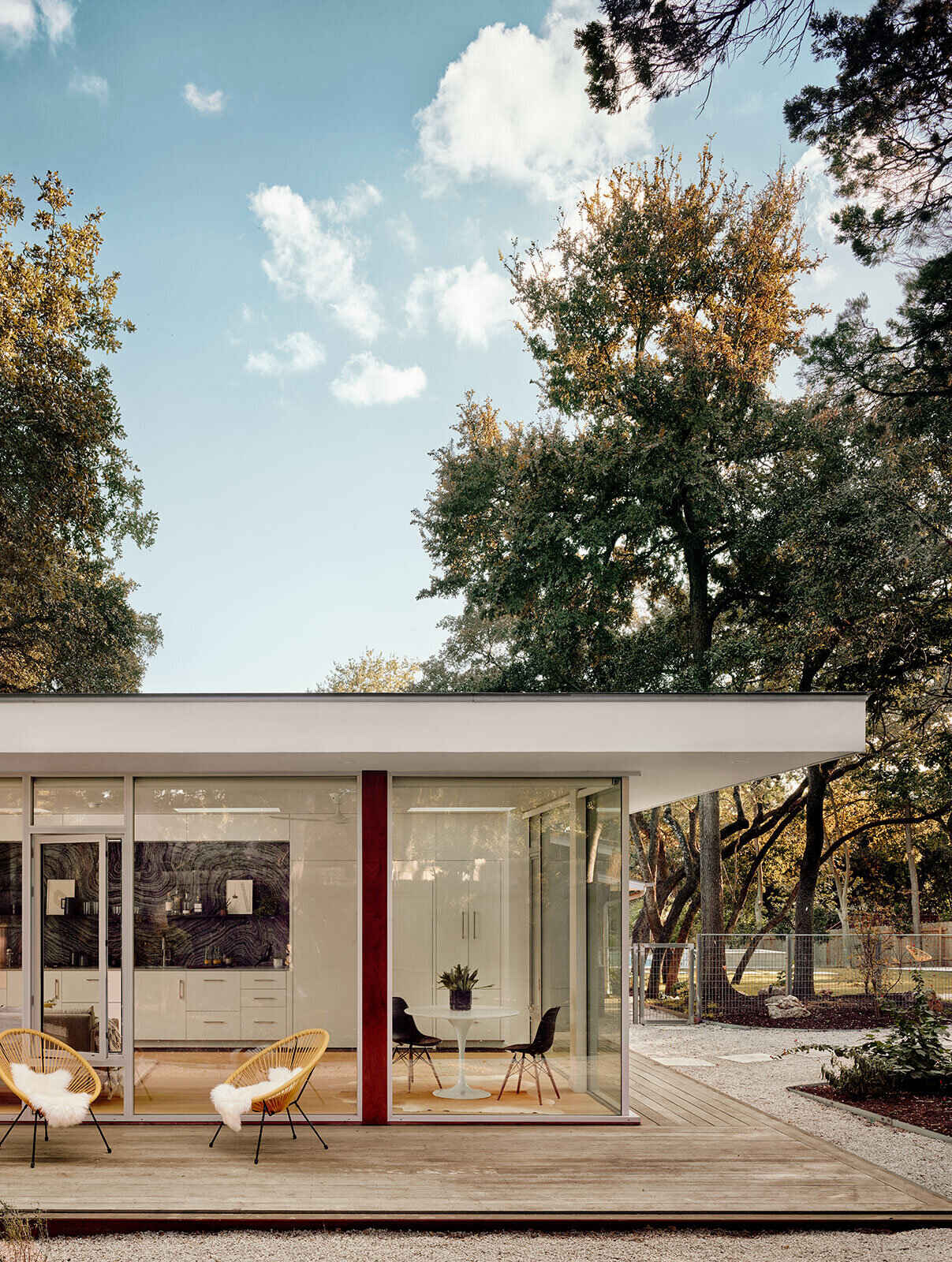 A compact glass guest house in Austin designed by Matt Garcia Design shows how thoughtful architecture can make a small 540 square foot ADU feel open and bright.