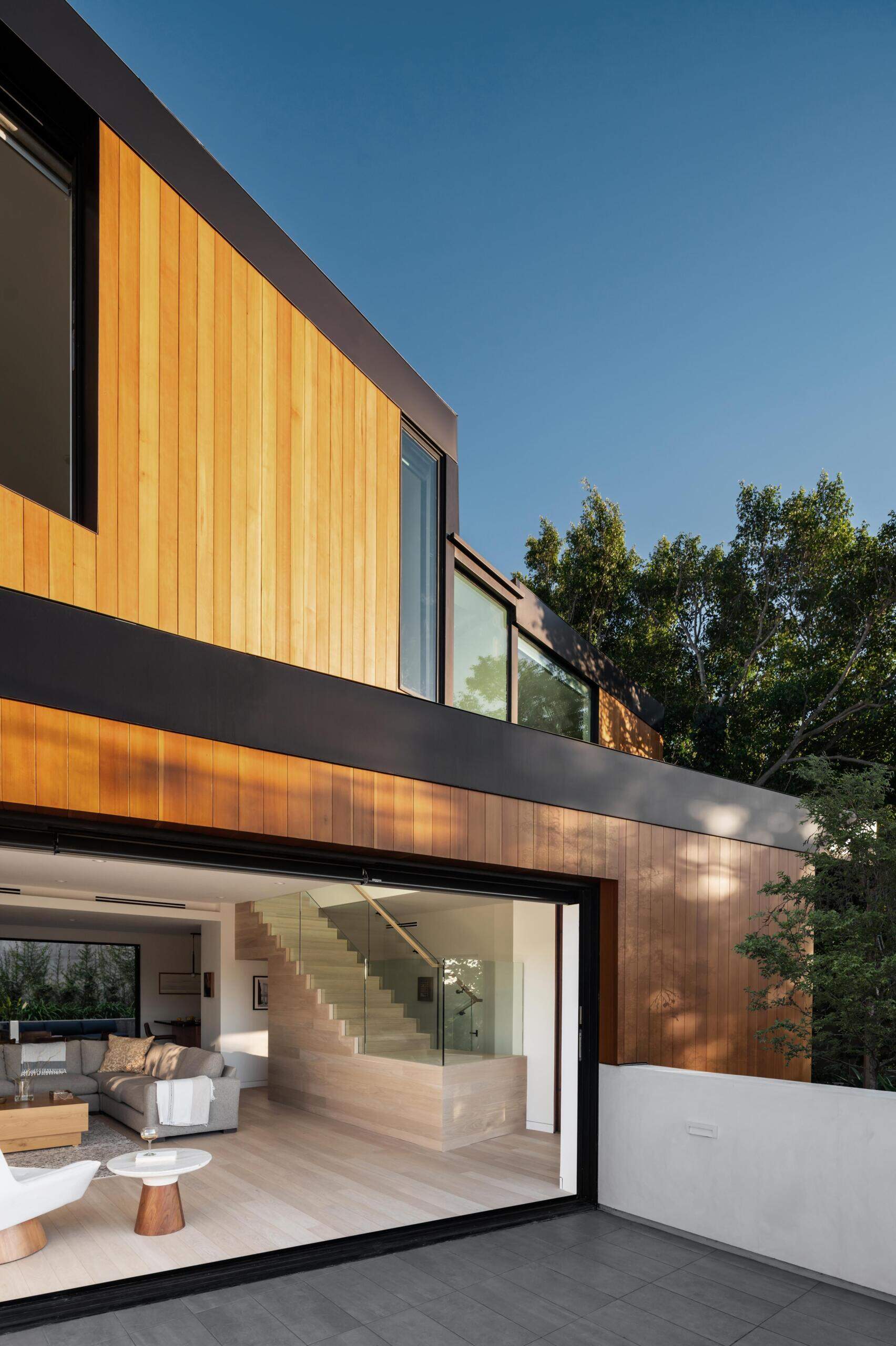The deck extends out from the living room, offering an easy transition outdoors. The sliding glass doors continues the flow of the interior while opening up to the view. This space adds another layer to how the home is experienced.