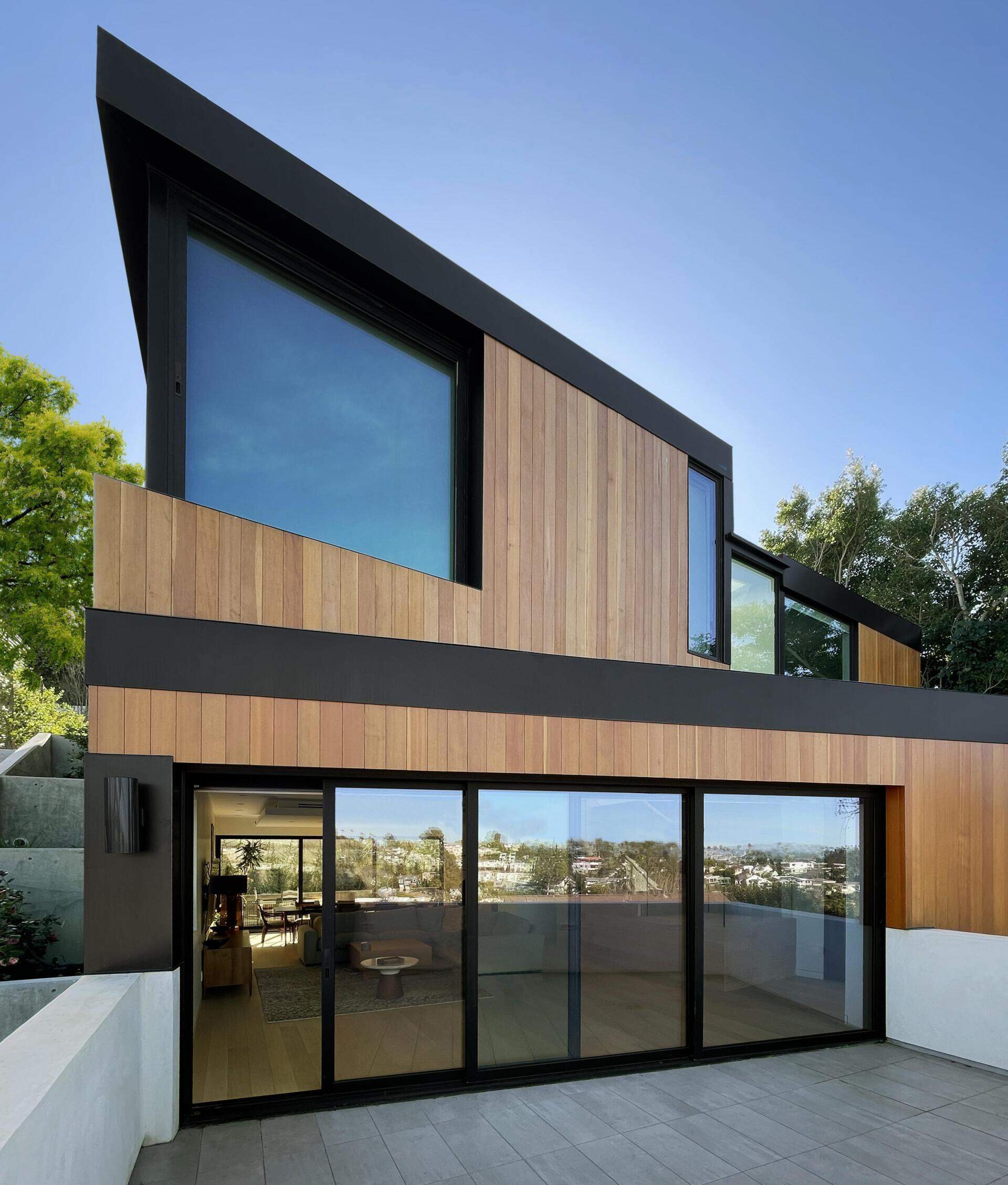 The deck extends out from the living room, offering an easy transition outdoors. The sliding glass doors continues the flow of the interior while opening up to the view. This space adds another layer to how the home is experienced.