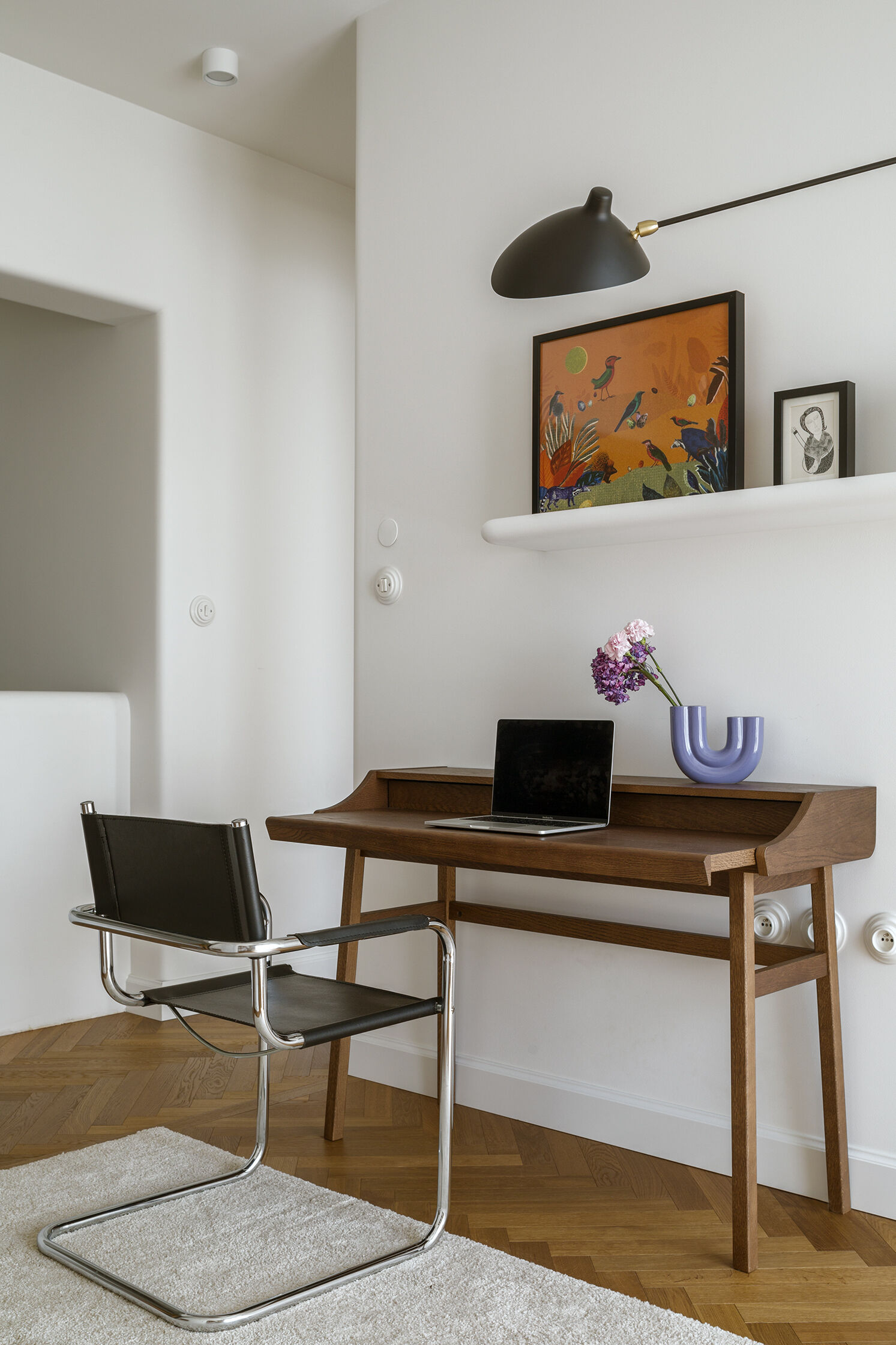 A light-filled home office that stays connected to the living space through open design and a consistent material palette.