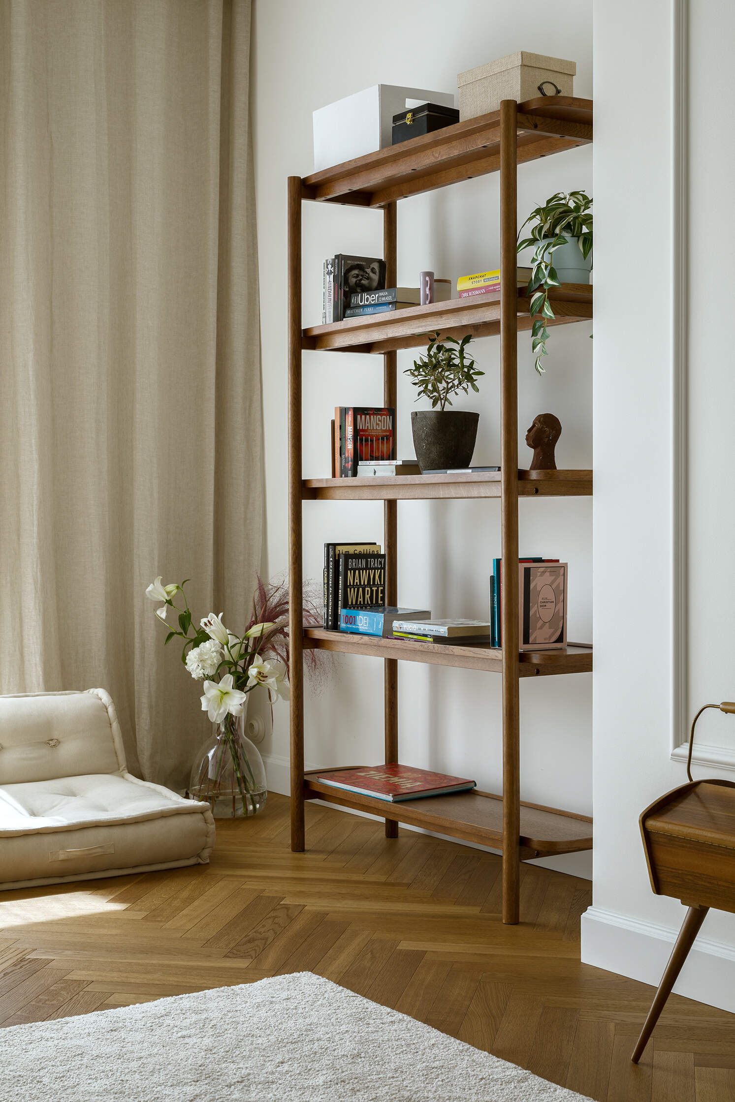 A light-filled home office that stays connected to the living space through open design and a consistent material palette.